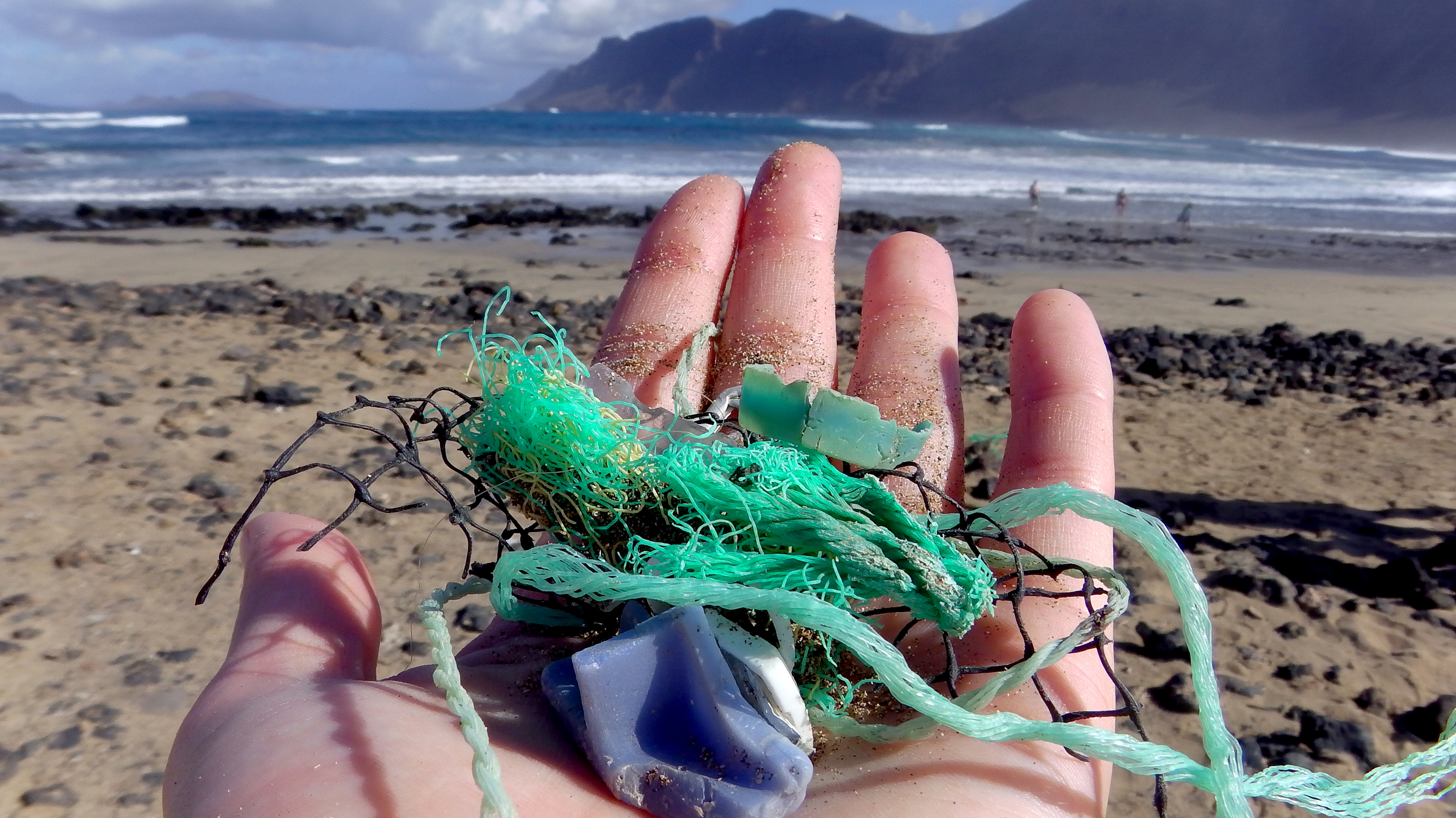 Study author Jenna Jambeck of the University of Georgia collects plastic samples from a beach near Caleta de Famara, Canary Islands, Spain. (Malin Jacob)