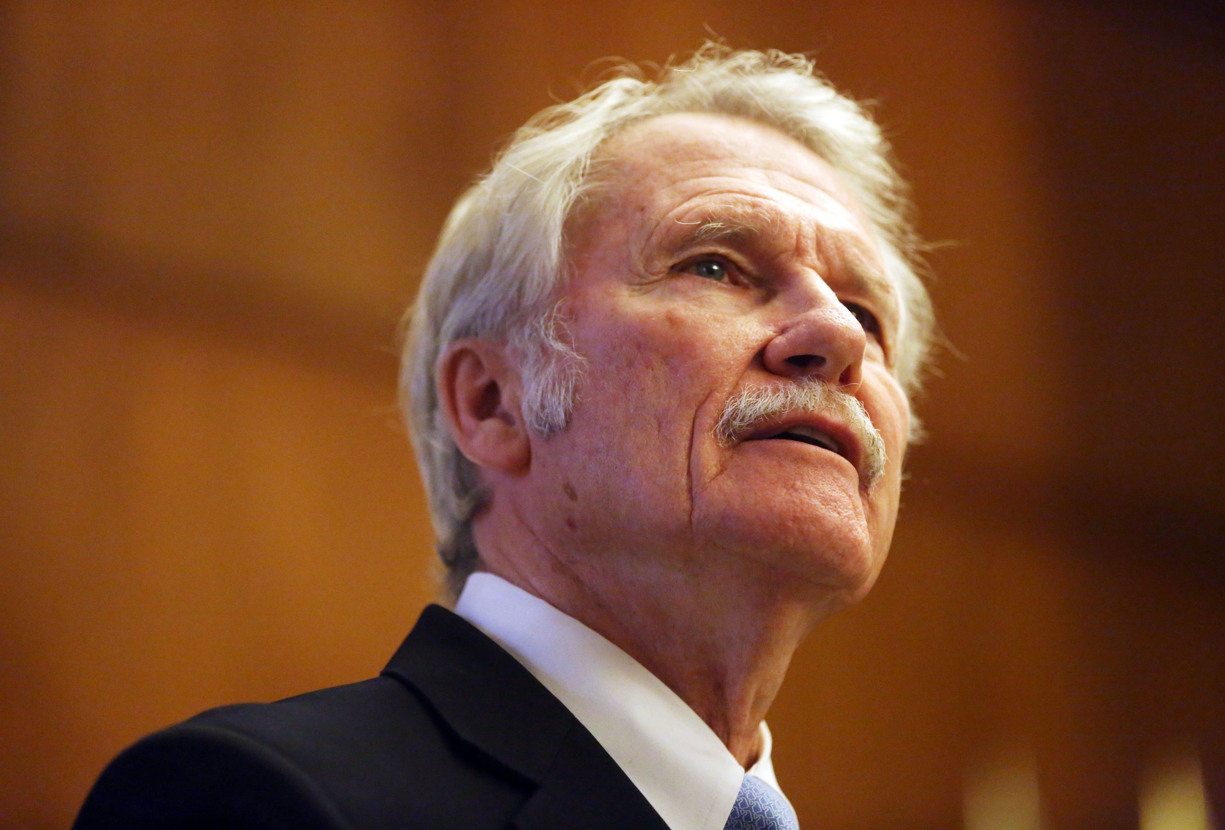 Gov. John Kitzhaber speaks to the media as he presents his two-year state budget proposal from his ceremonial office at the State Capitol in Salem, Ore., on Dec. 1, 2014.