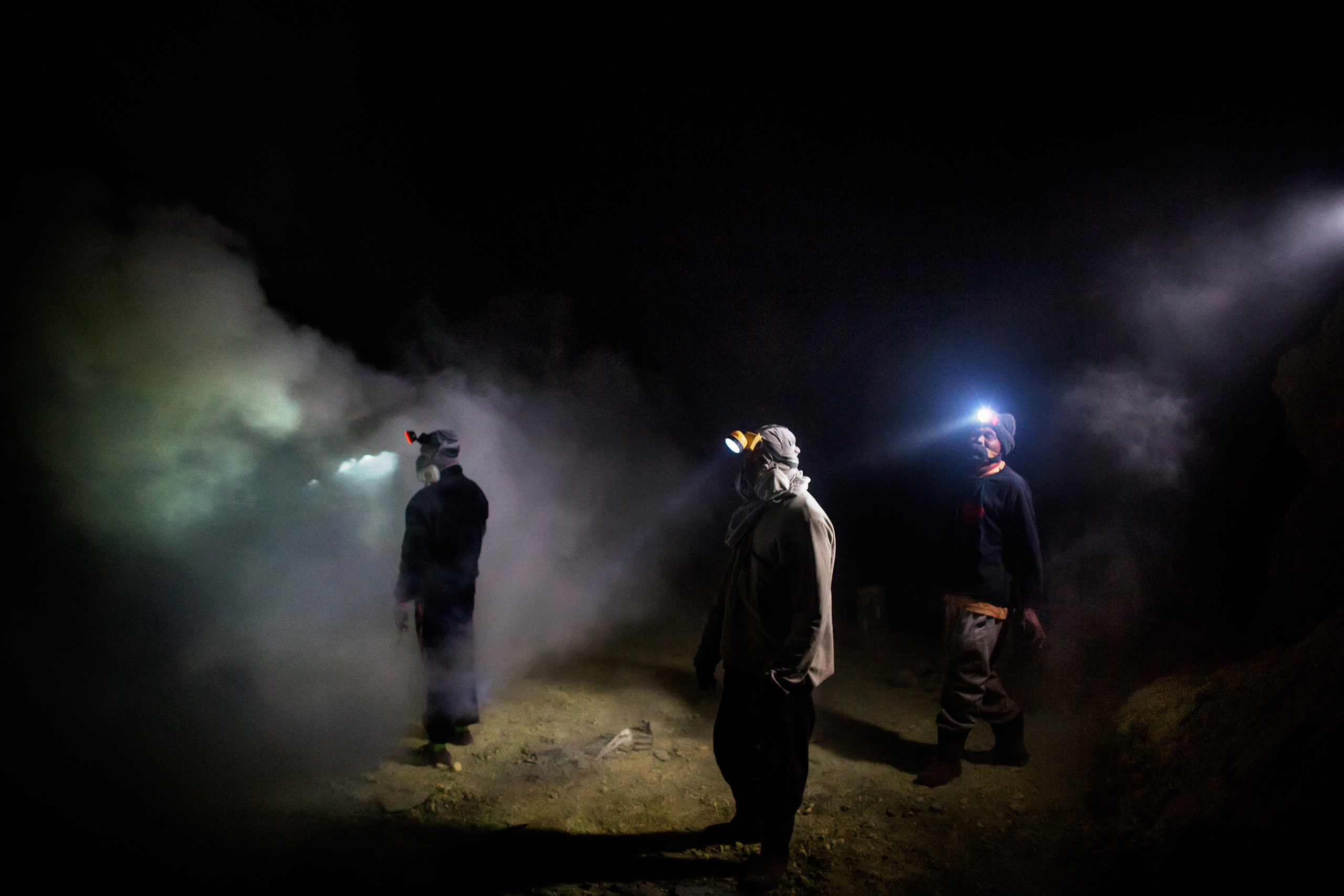A group of miners look for sulfur slabs, Nov. 4, 2014. Mining at Kawah Ijen officially began in 1968, and a state company is now running the mine.
