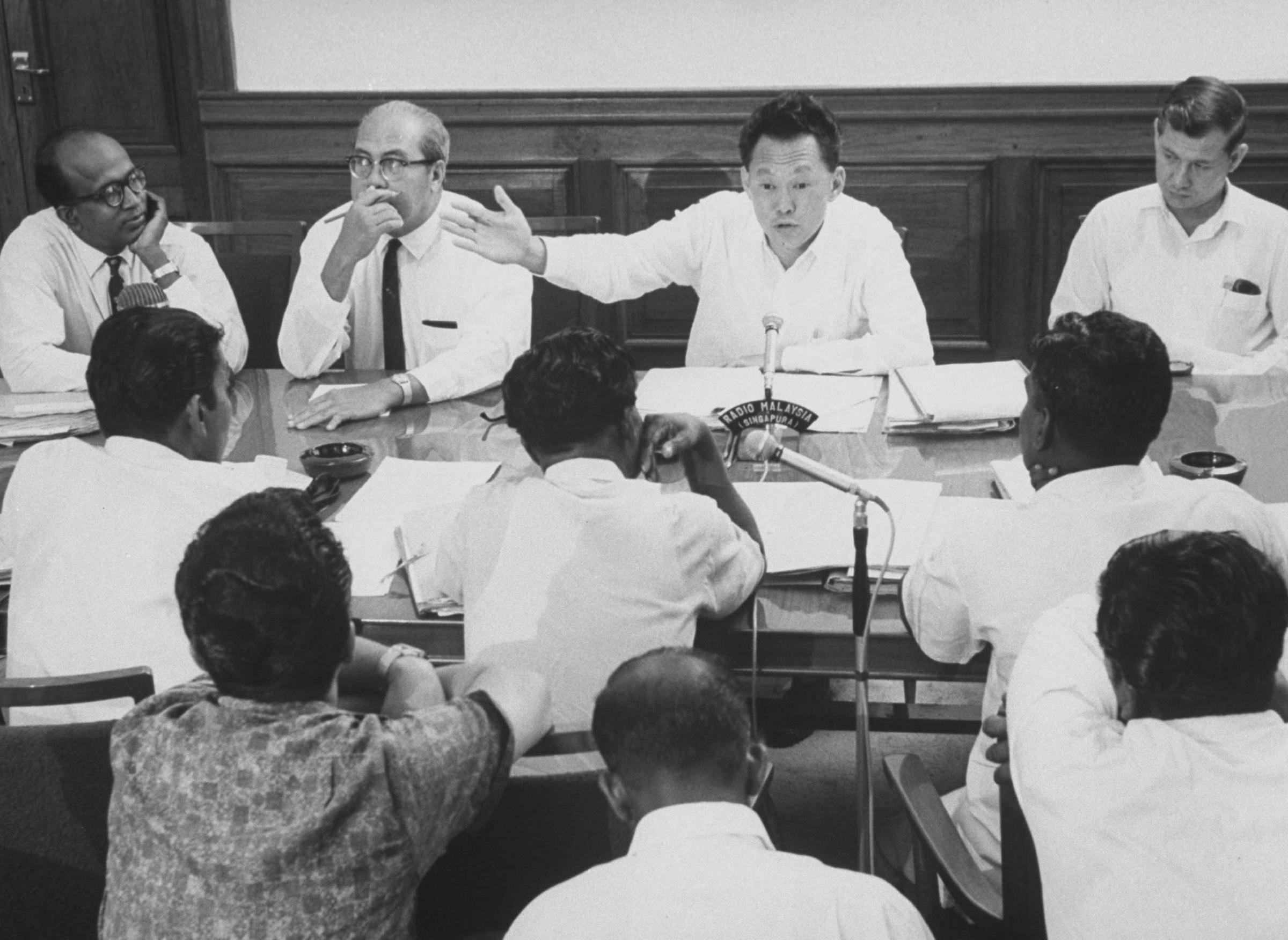 Prime Minister Kuan Yew Lee in conference with Labor leaders during strike threat in 1965.