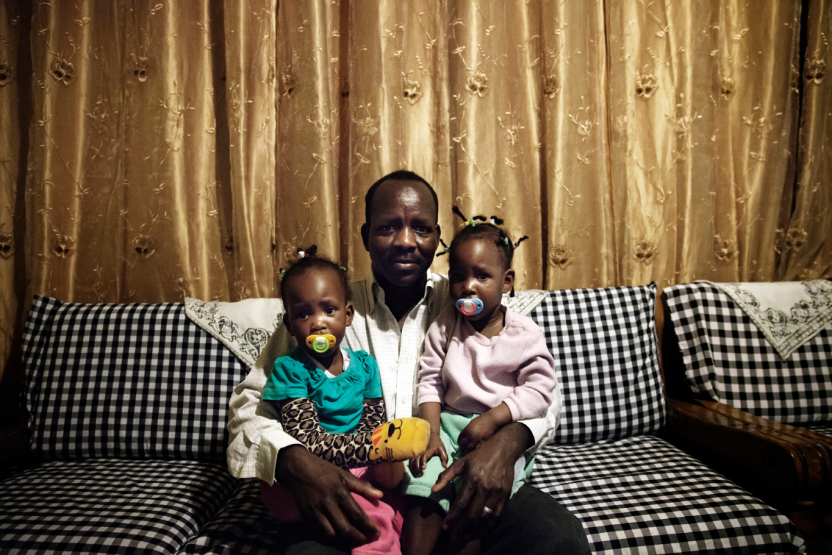 Boshora Adam with his twin daughters in their home in Tel Aviv. Boshora has been in Israel for 5 years and has a conditional visa that he renews every 6 months. He will not be invited to Holot because he is married and that exempts him from being called.  “The hardest part about raising my children in Israel is that it’s becoming more segregated. All the Israeli children left my children’s school. Even on the playground you notice that parents keep their children away from African children, and this worries me for my children’s future.”