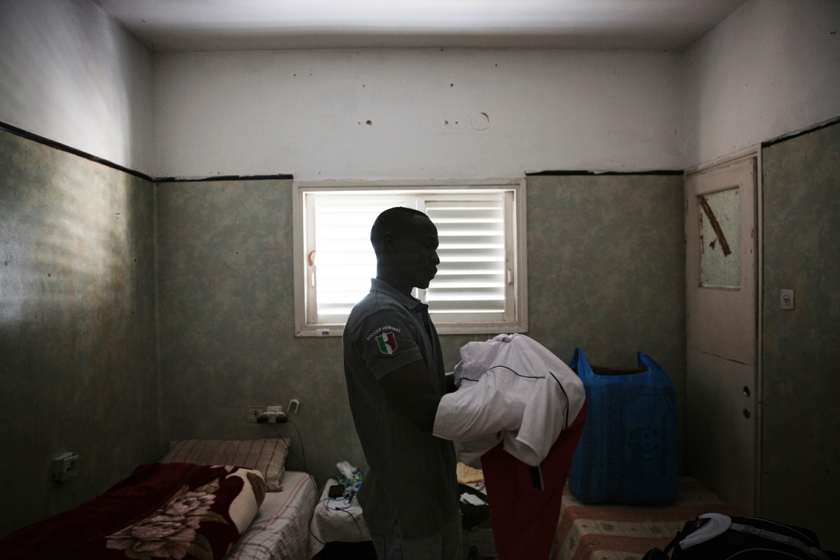 Ahmed Dahiya, 29, is packing to go to Holot detention center. "I have no idea what the future holds for me, one thing I am certain of, is that if I return to Sudan, I face life in prison or death.” Ahmed escaped military service in Sudan. “ They wanted me to fight my own people and when I refused and they detained me and tortured me, and then I escaped. Going back to Sudan is not an option for me.”