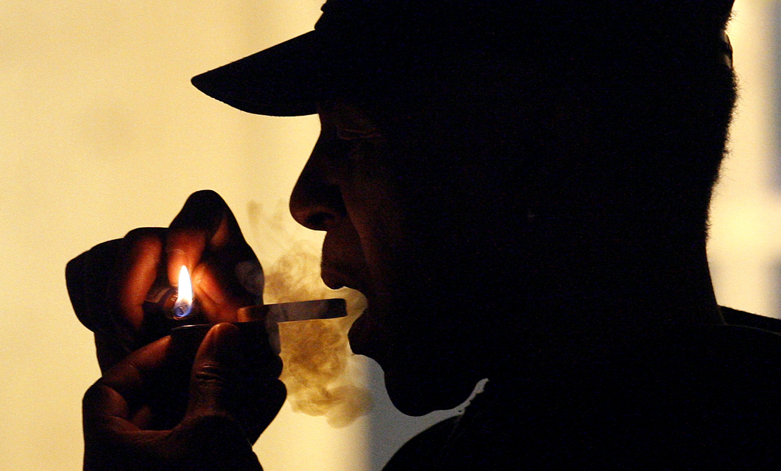 A man is seen smoking medical marijuana during karaoke night at the Cannabis Café, in Portland, Ore. in 2011. (Rick Bowmer—AP)