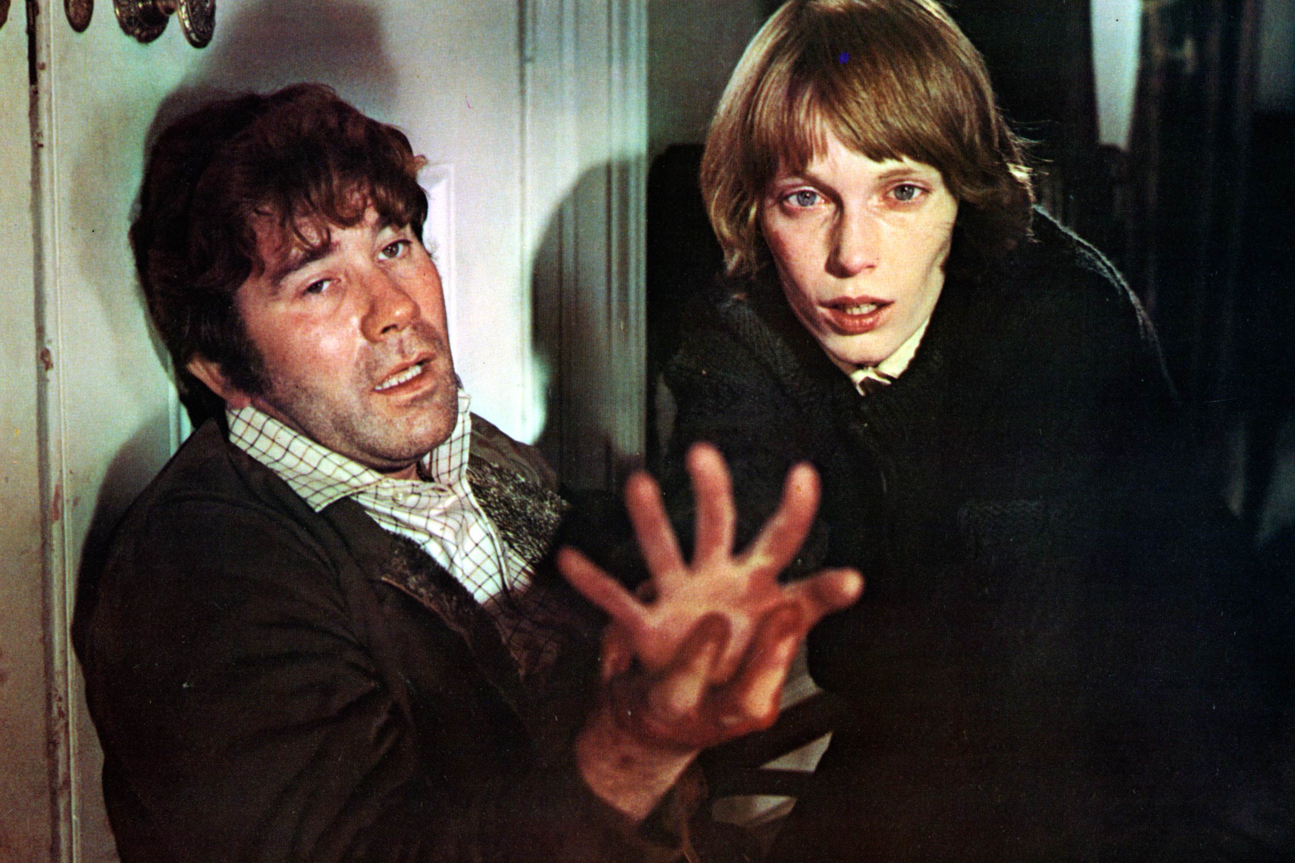 Brian Rawlinson guides the hand of Mia Farrow in a scene from the film Blind Terror, 1971.