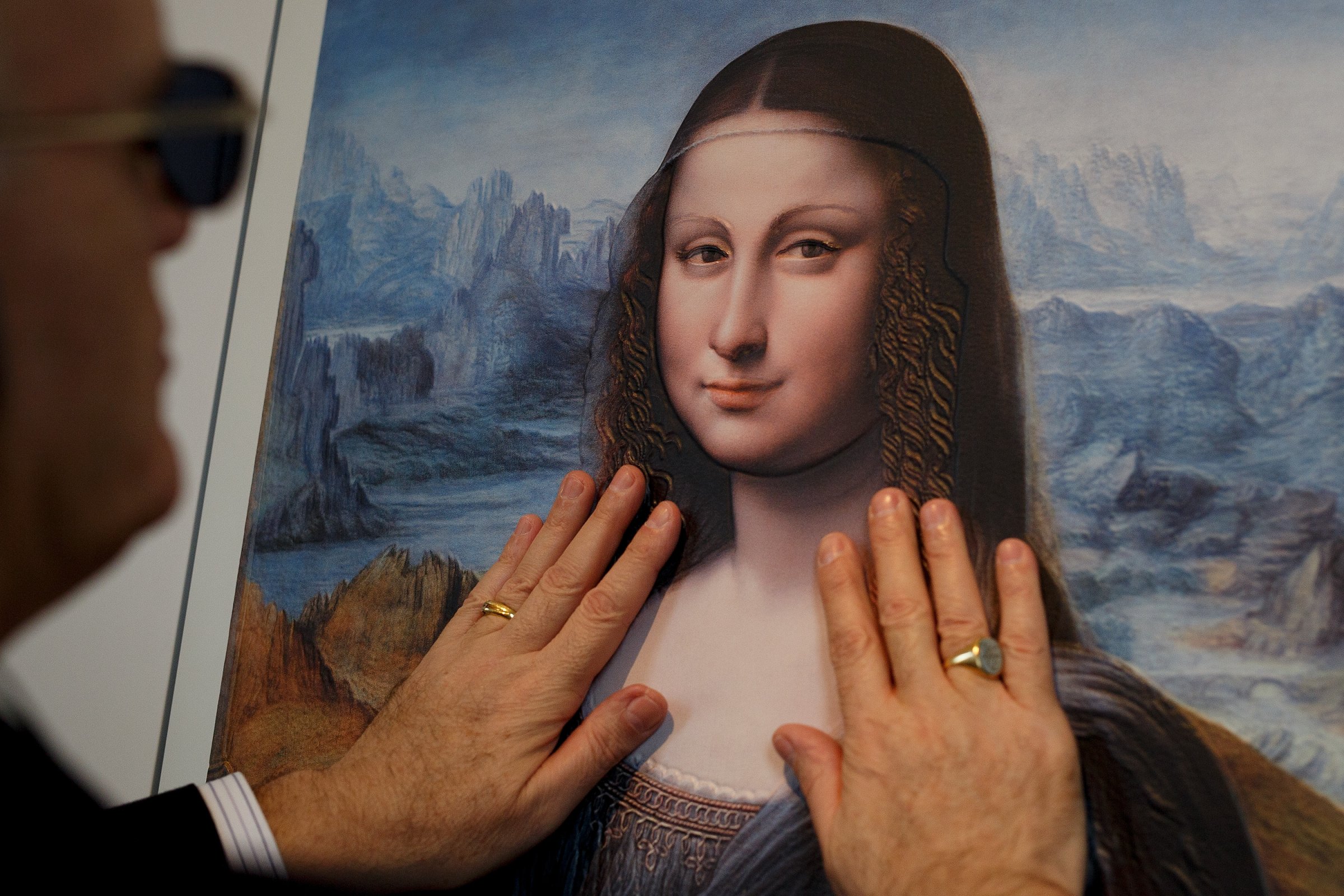 A blind person feels with his hands a copy of 'The Mona Lisa" at The Prado Museum on Feb. 10, 2015 in Madrid.