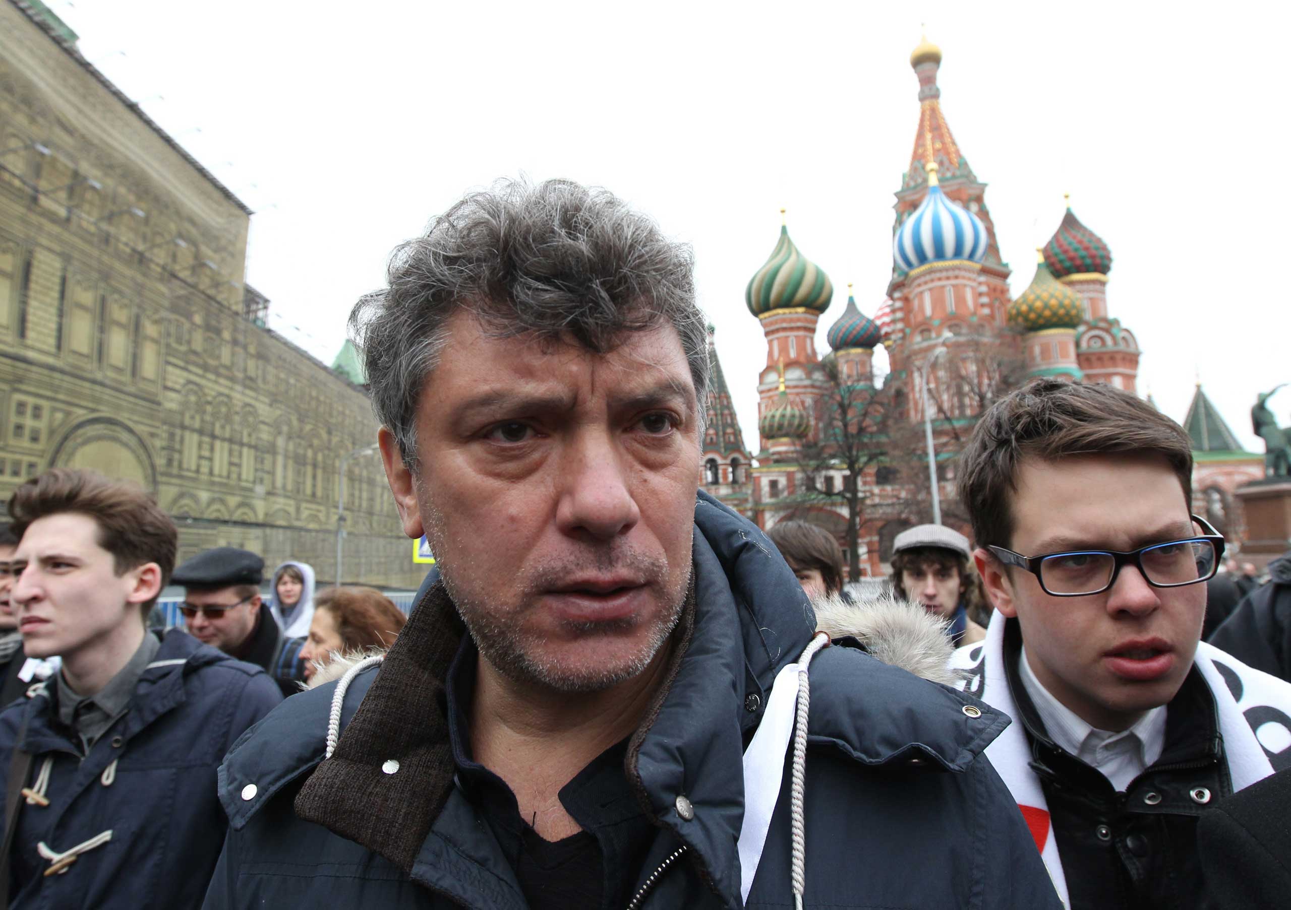 Boris Nemtsov, center, and other opposition activists attend a rally at Red Square on April 8, 2012 in Moscow. (Sasha Mordovets—Getty Images)