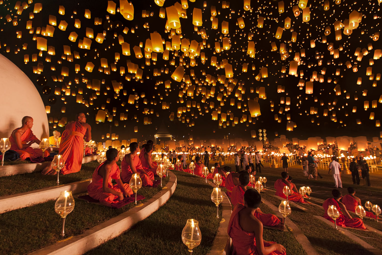 Ng Chai Hock: "Monks look up at a magnificent night sky filled with thousands of lanterns during the Yi Peng lantern festival. This was the moment I'd been waiting for and it passed very quickly due to strong wind. A very heavy downpour occurred right after we left."