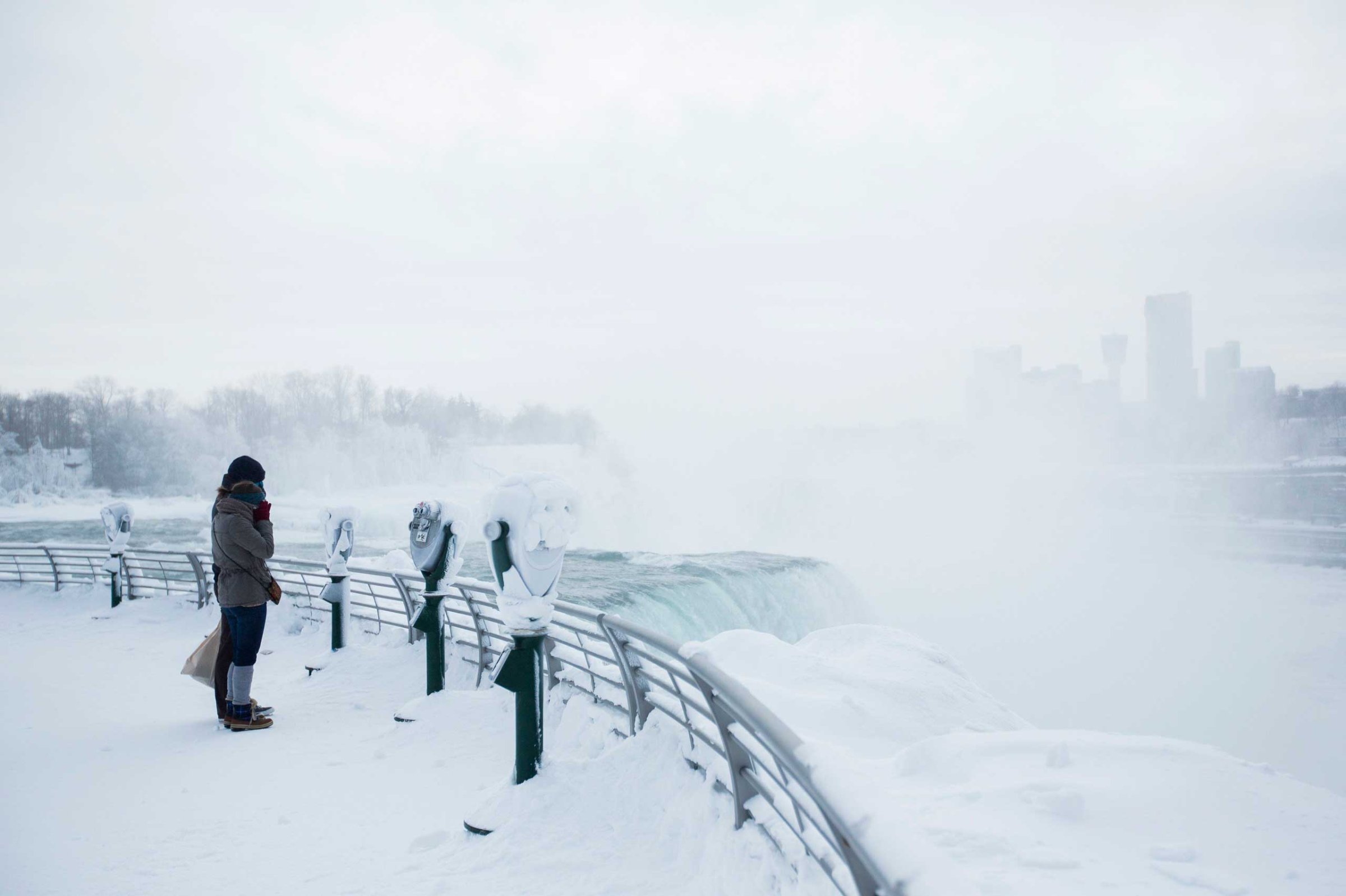 Visitors view frozen Niagara Falls in Niagara Falls, New York, Feb. 17, 2015.