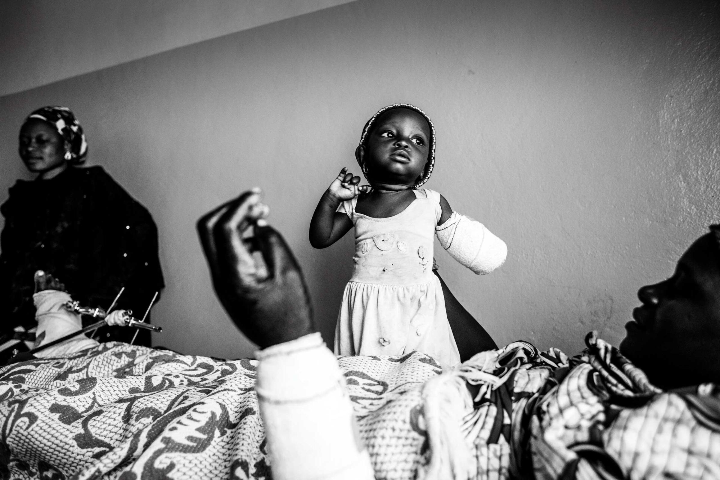 The Washington Post In Sight: The enemy within: A closer look at survivors of Boko Haram attacks across Northern NigeriaEight month old Afiniki lost her left arm in a Boko Haram attack on the Christian village of Chakawa in Jos, Nigeria, Jan. 2014.