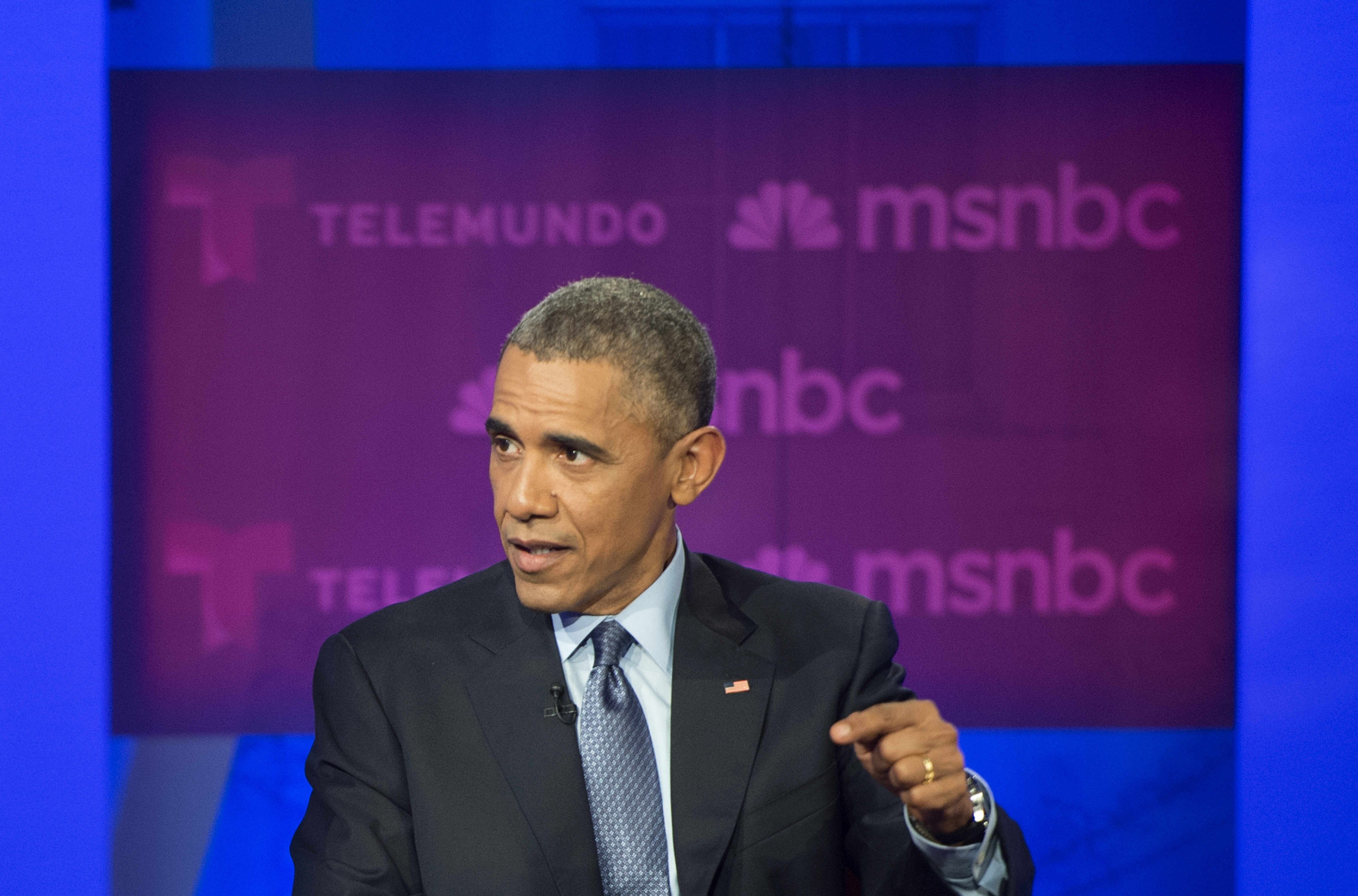 President Barack Obama answers a question from the audience during an immigration town hall meeting and Telemundo interview at Florida International University in Miami on Feb. 25, 2015.