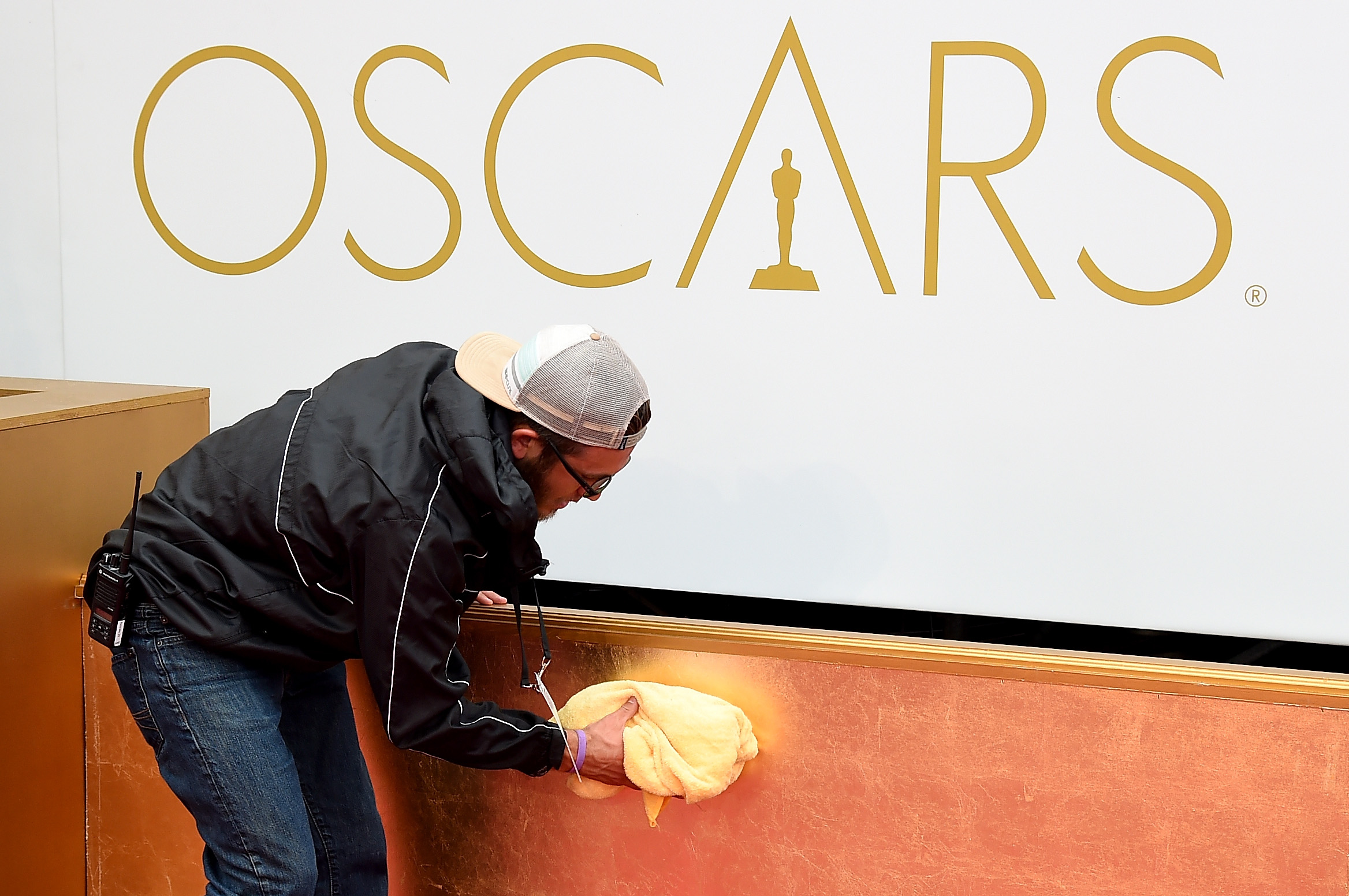 A member of the crew works on the red carpet of the 87th Annual Academy Awards at Hollywood &amp; Highland Center on Feb. 22, 2015 in Hollywood. (Ethan Miller—WireImage)