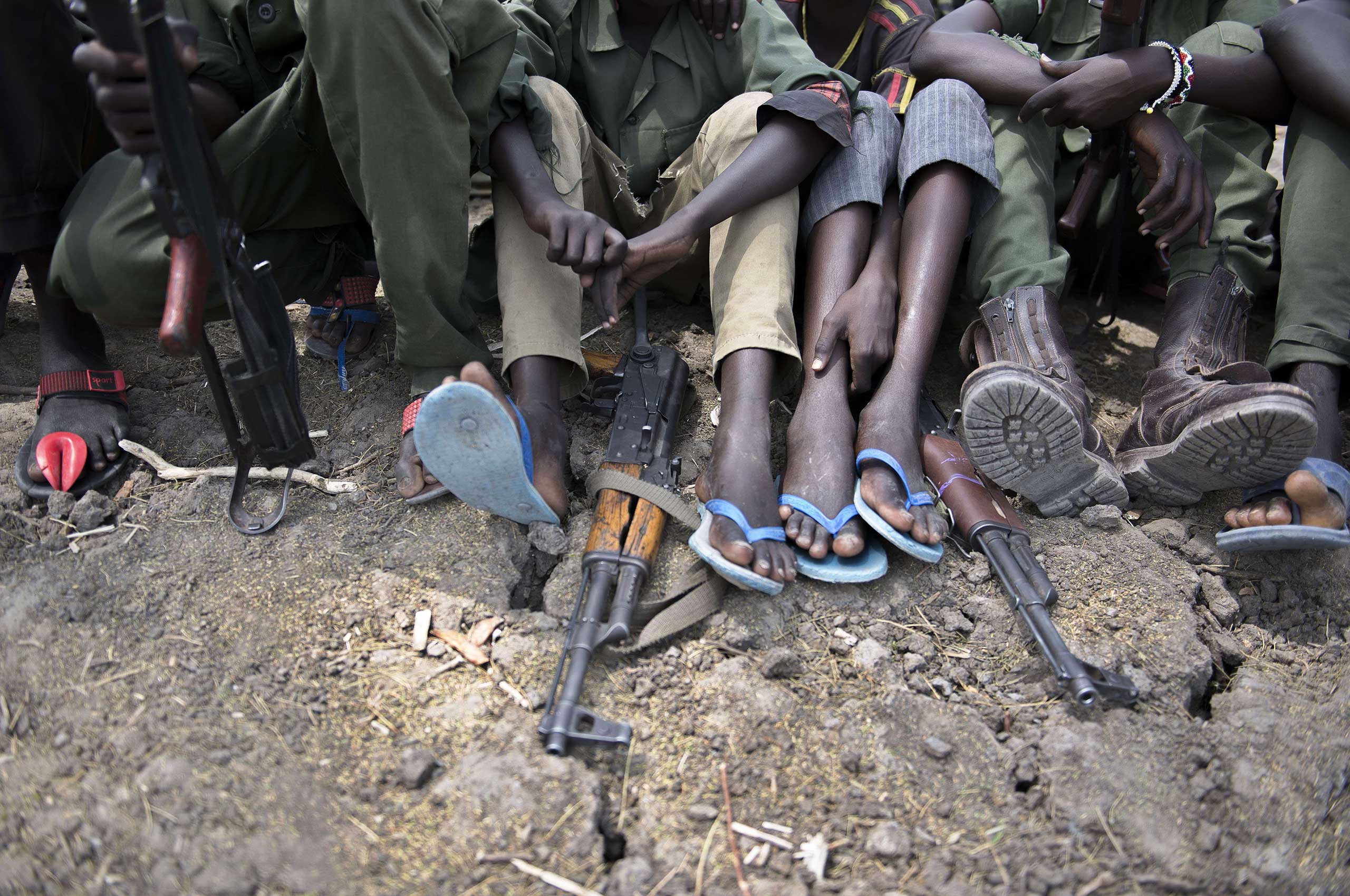 Feb.10, 2015. Child soldiers in Pibor, Jonglei State in South Sudan, surrender their weapons and uniforms in a ceremony overseen by UNICEF, the South Sudan National Disarmament, Demobilization and Reintegration Commission, and the South Sudan Democratic Army Cobra Faction.
