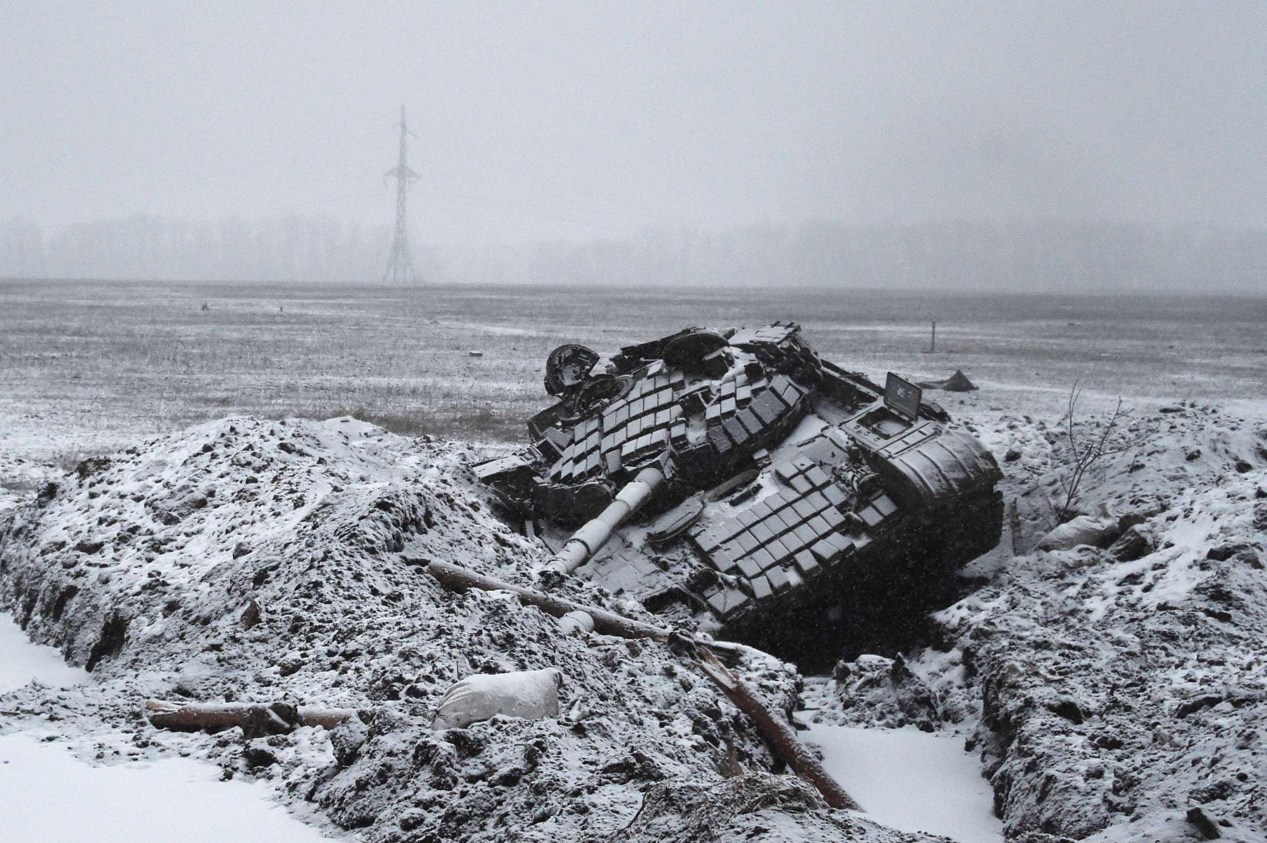 Feb. 9, 2015. A destroyed Ukrainian Army tank sits outside Uglegorsk, 3 miles southwest of Debaltseve, Ukraine. The European Union put fresh sanctions against Moscow on hold ahead of a summit to thrash out a Ukraine peace plan aimed at ending 10 months of bloodshed.