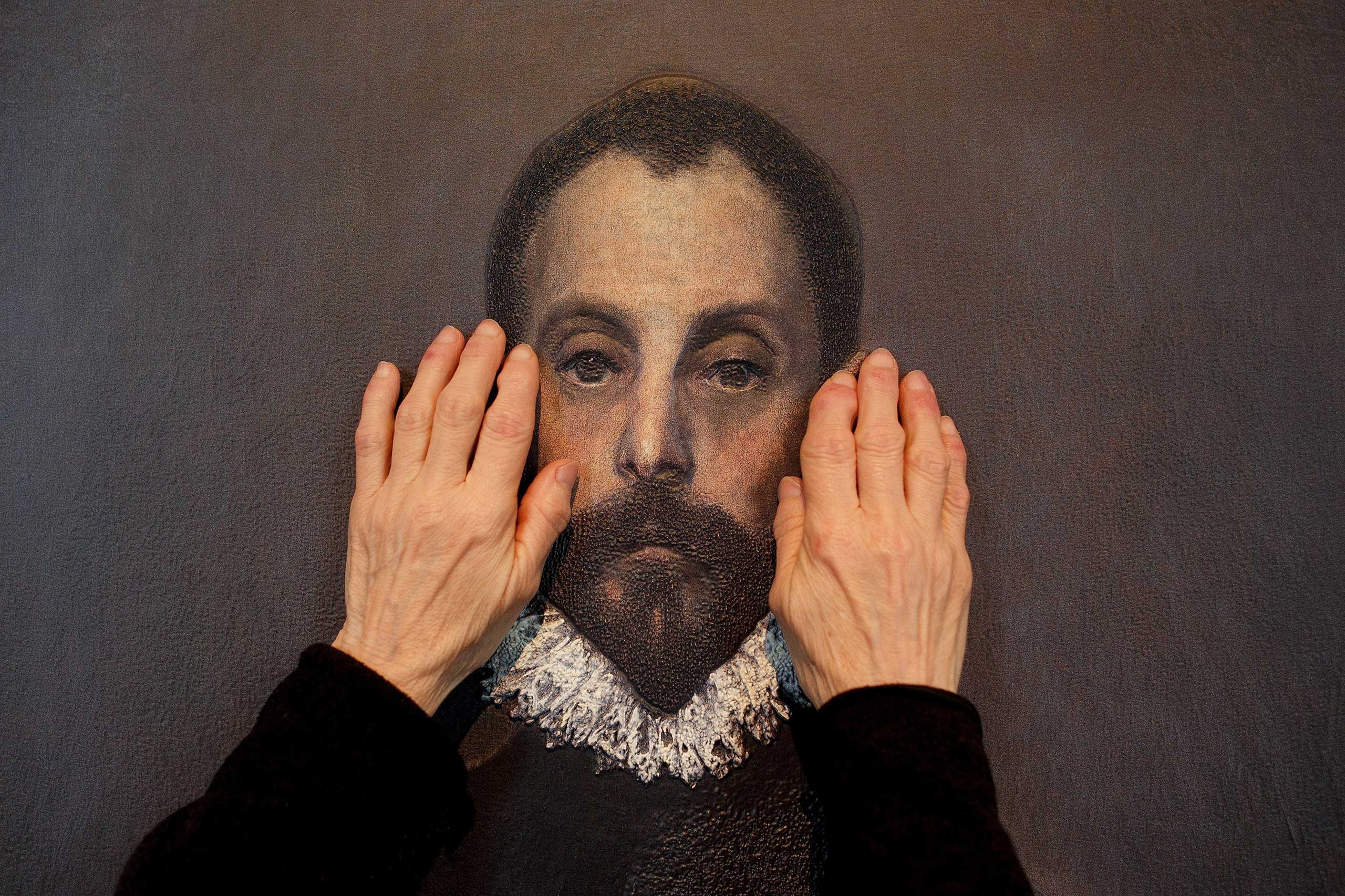 Feb. 10, 2015. A blind person feels a copy of 'The gentleman with his hand on his chest' of El Greco with her hands at The Prado Museum in Madrid. Hoy toca el Prado (Touch The Prado) allows blind or vision-impaired visitors to explore with their hands the copies of six masterworks. The copies were created using a technique called Didu which provides texture and volume to the paintings.