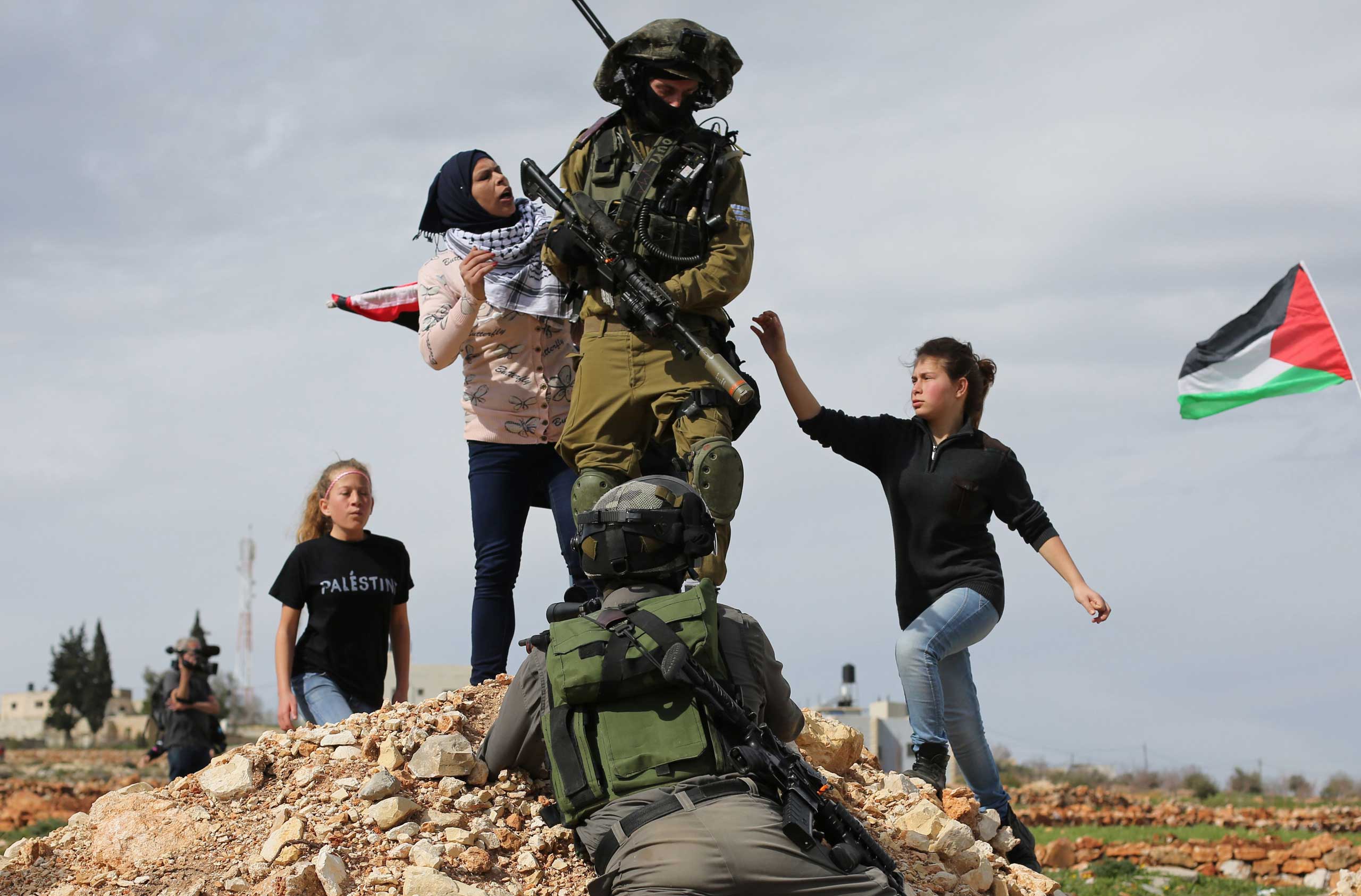 Feb. 6, 2015. Palestinian protesters scuffle with Israeli security forces during clashes following a demonstration in the West Bank village of Nabi Saleh, to protest against the expansion of Jewish settlements on Palestinian land.