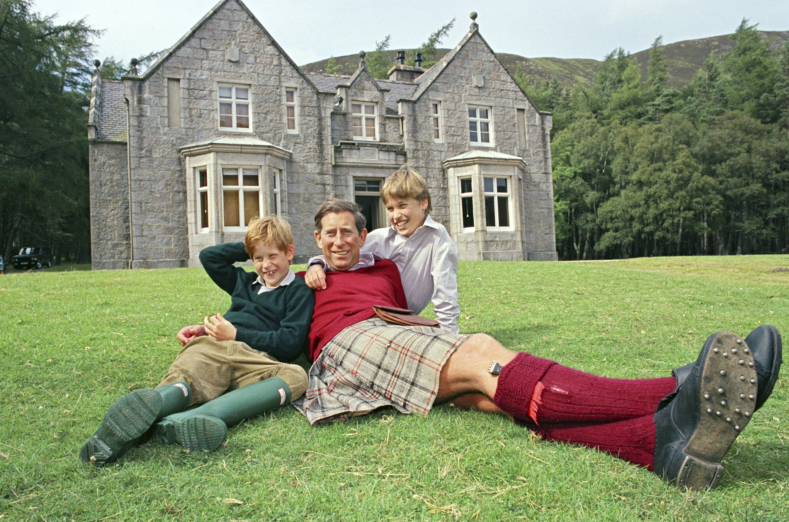 Charles and his sons relax on the lawn of Glas-allt Shiel, a royal lodge by the shores of a lake on the Balmoral estate in Scotland, in 1993. (Lesley Donald—Sygma/Corbis)