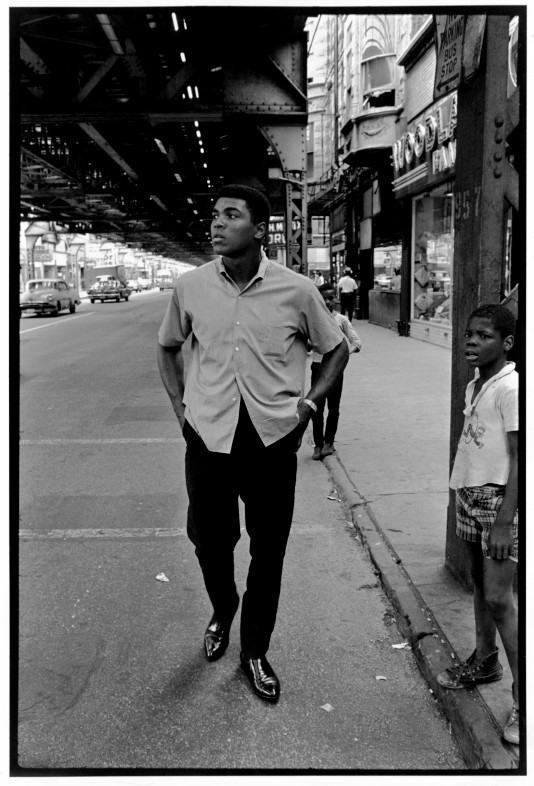 USA. Chicago, Illinois. 1966. World heavyweight champion Muhammad ALI walks underneath elevated trains. Contact email:New York : photography@magnumphotos.comParis : magnum@magnumphotos.frLondon : magnum@magnumphotos.co.ukTokyo : tokyo@magnumphotos.co.jpContact phones:New York : +1 212 929 6000Paris: + 33 1 53 42 50 00London: + 44 20 7490 1771Tokyo: + 81 3 3219 0771Image URL:http://www.magnumphotos.com/Archive/C.aspx?VP3=ViewBox_VPage&amp;IID=2S5RYDIN0YHS&amp;CT=Image&amp;IT=ZoomImage01_VForm
