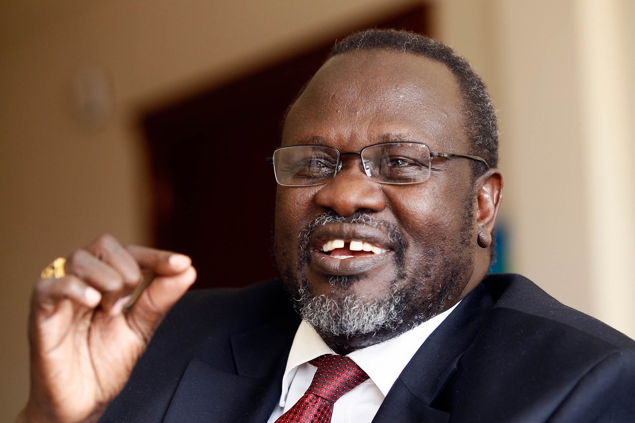 South Sudan's rebel leader Riek Machar speaks during an interview with Reuters in his office in Addis Ababa