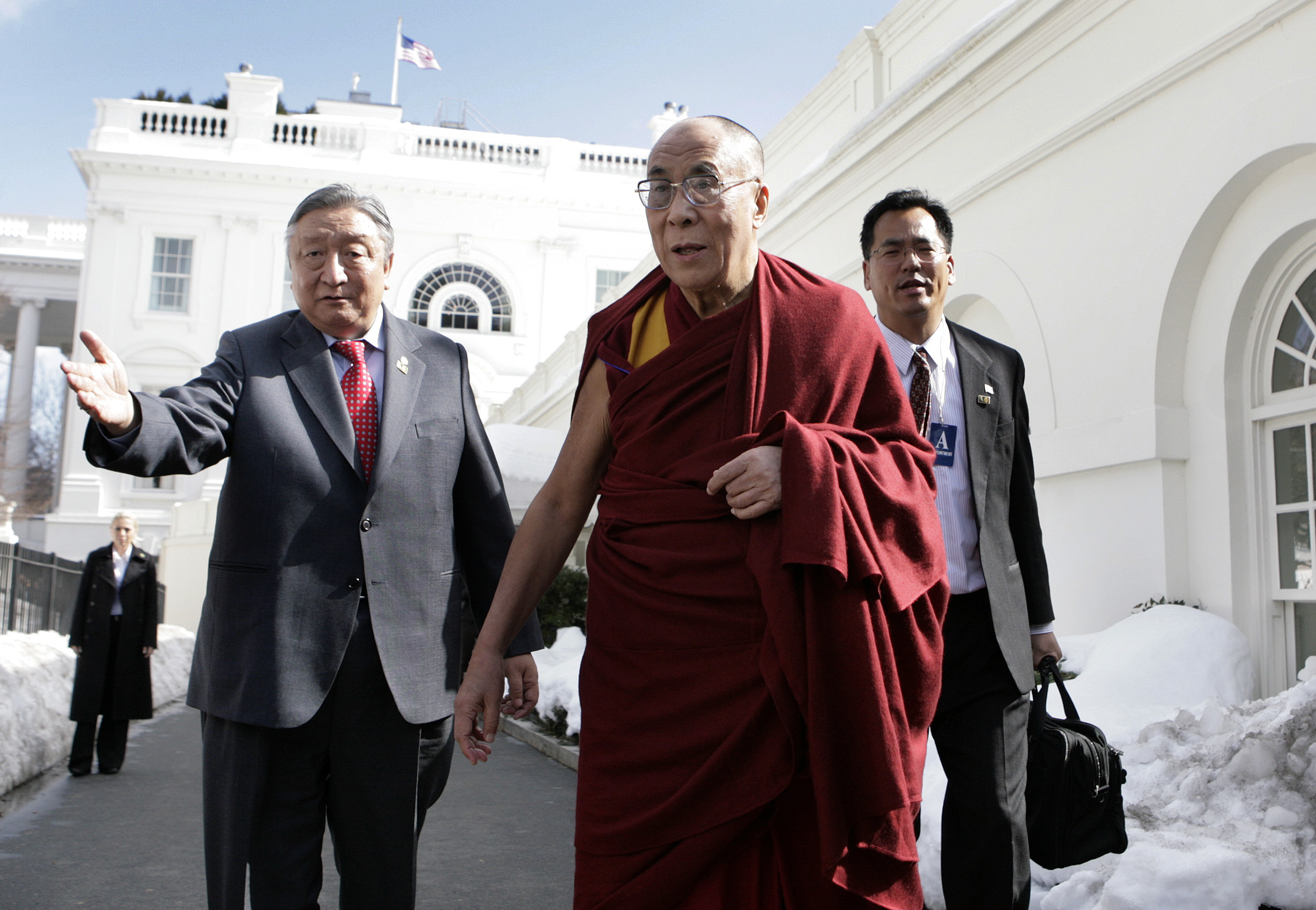 The Dalai Lama talks to the media after a meeting with President Barack Obama in Washington