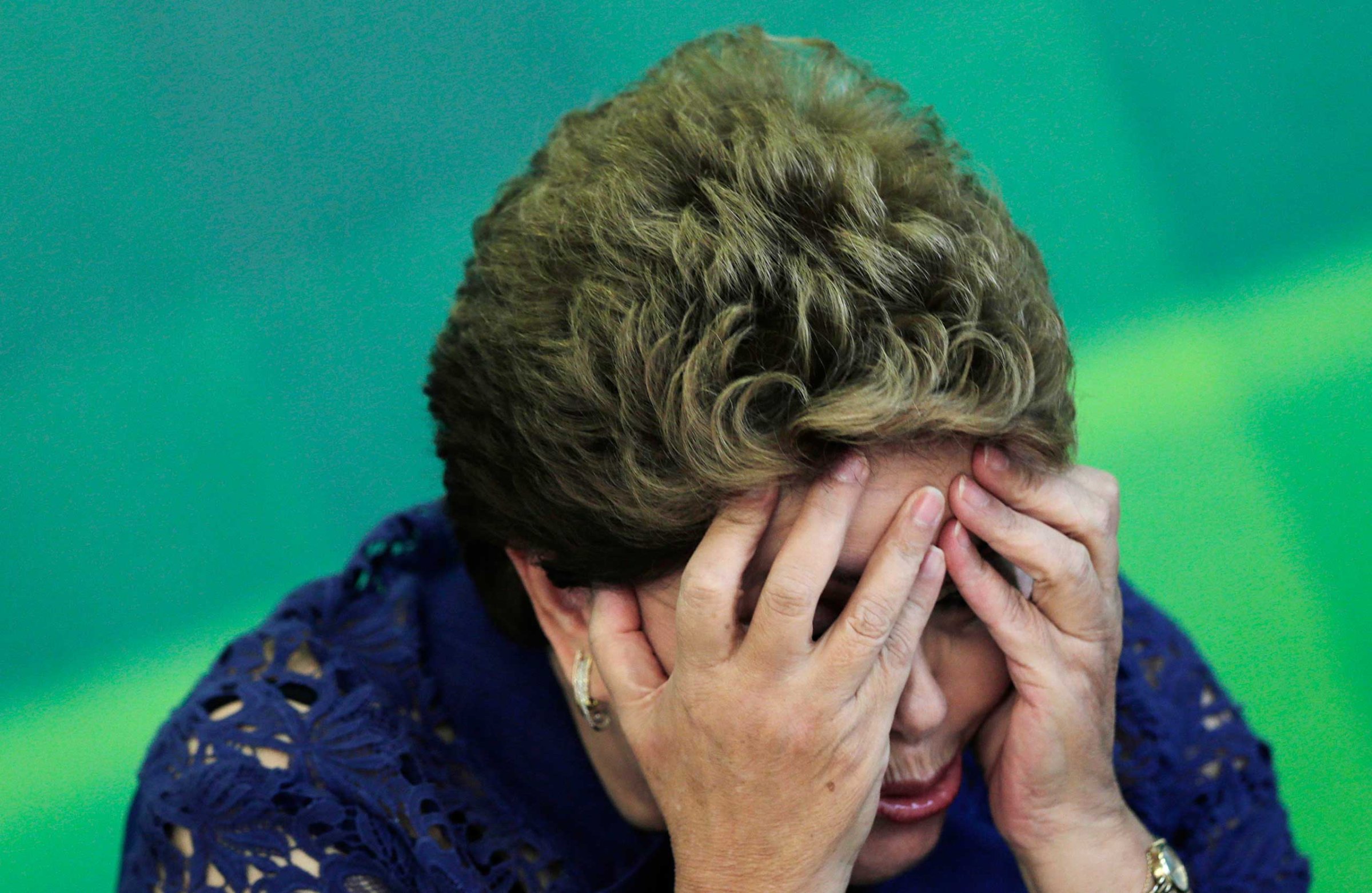 Brazilian President Dilma Rousseff reacts during a breakfast meeting with the media at the Planalto Palace in Brasilia