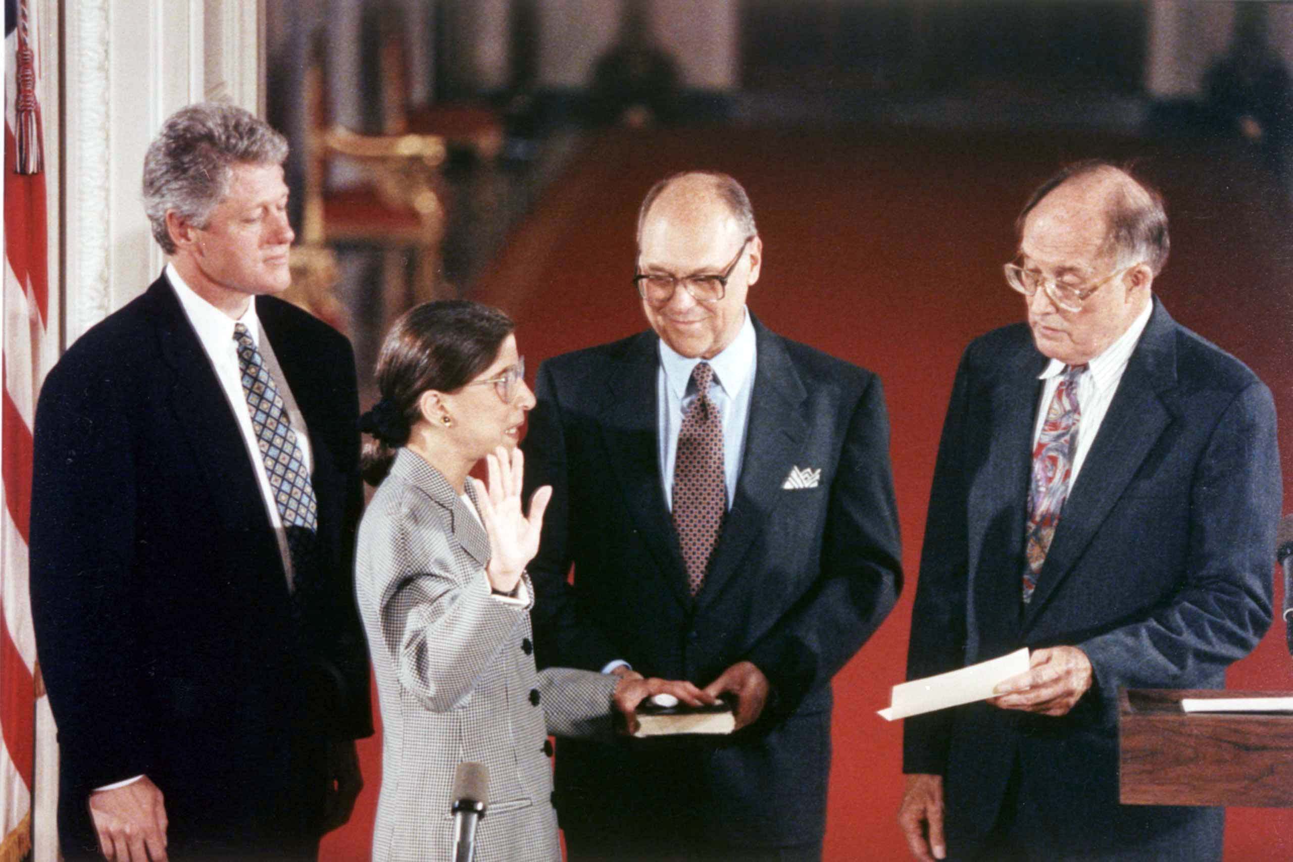 August 10, 1993 Justice Ruth Bader Ginsburg is sworn in as an Associate Justice of the Supreme Court. From left to right stand President Bill Clinton, Justice Ruth Bader Ginsburg, Martin Ginsburg, and Chief Justice William Rehnquist. (Collection of the Supreme Court of the United States)