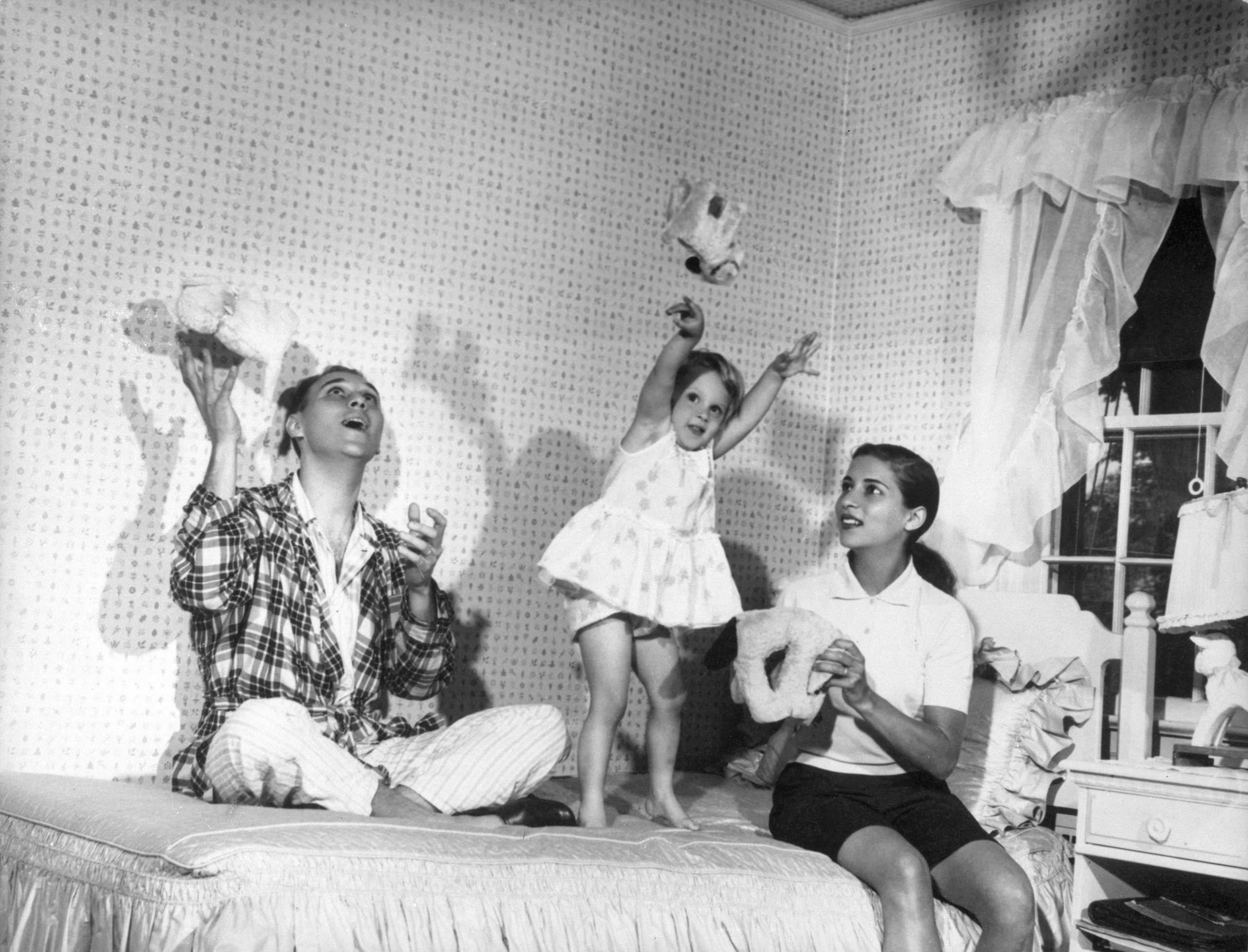 Summer 1958
                              Ruth Bader Ginsburg and Martin Ginsburg play with their three-year old daughter, Jane, in her bedroom at Martin's parents' home in Rockville Centre, N.Y