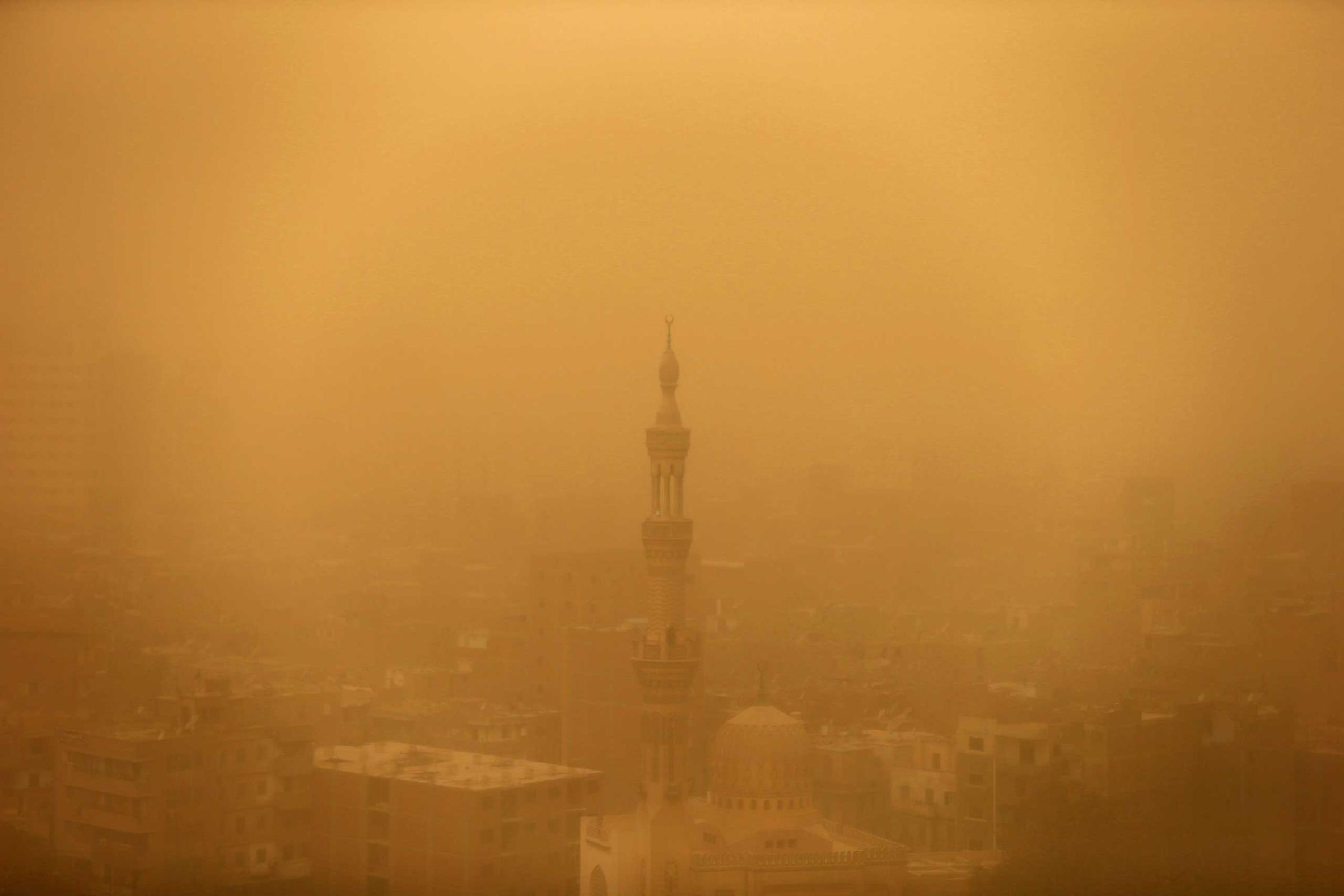 A mosque is seen through the haze of a sandstorm in Cairo, Feb. 11, 2015.
