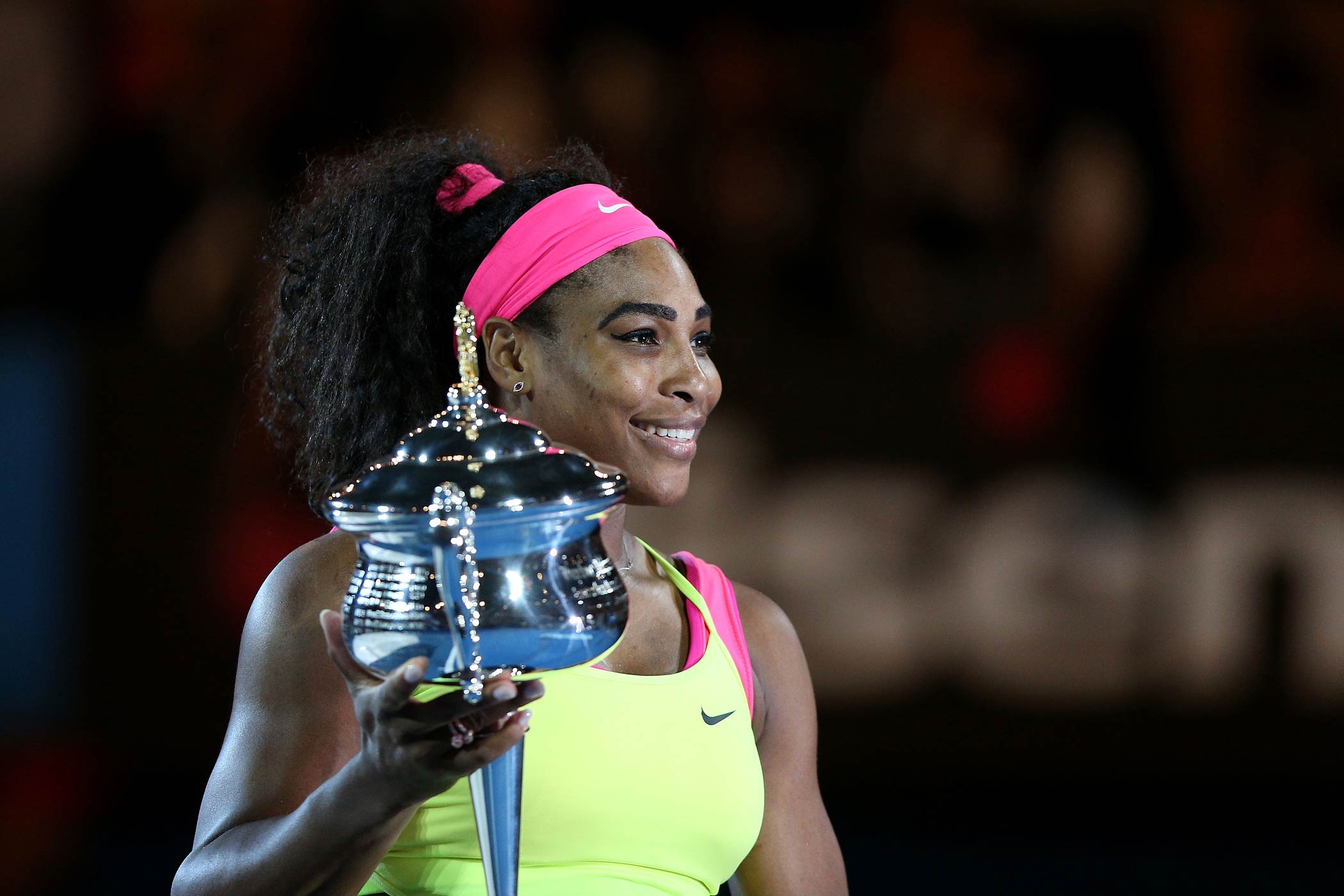 Serena Williams holds the Daphne Akhurst Memorial Cup after winning the women's final match against Maria Sharapova at the Australian Open on Jan. 31, 2015 in Melbourne, Australia. (Hannah Peters—Getty Images)