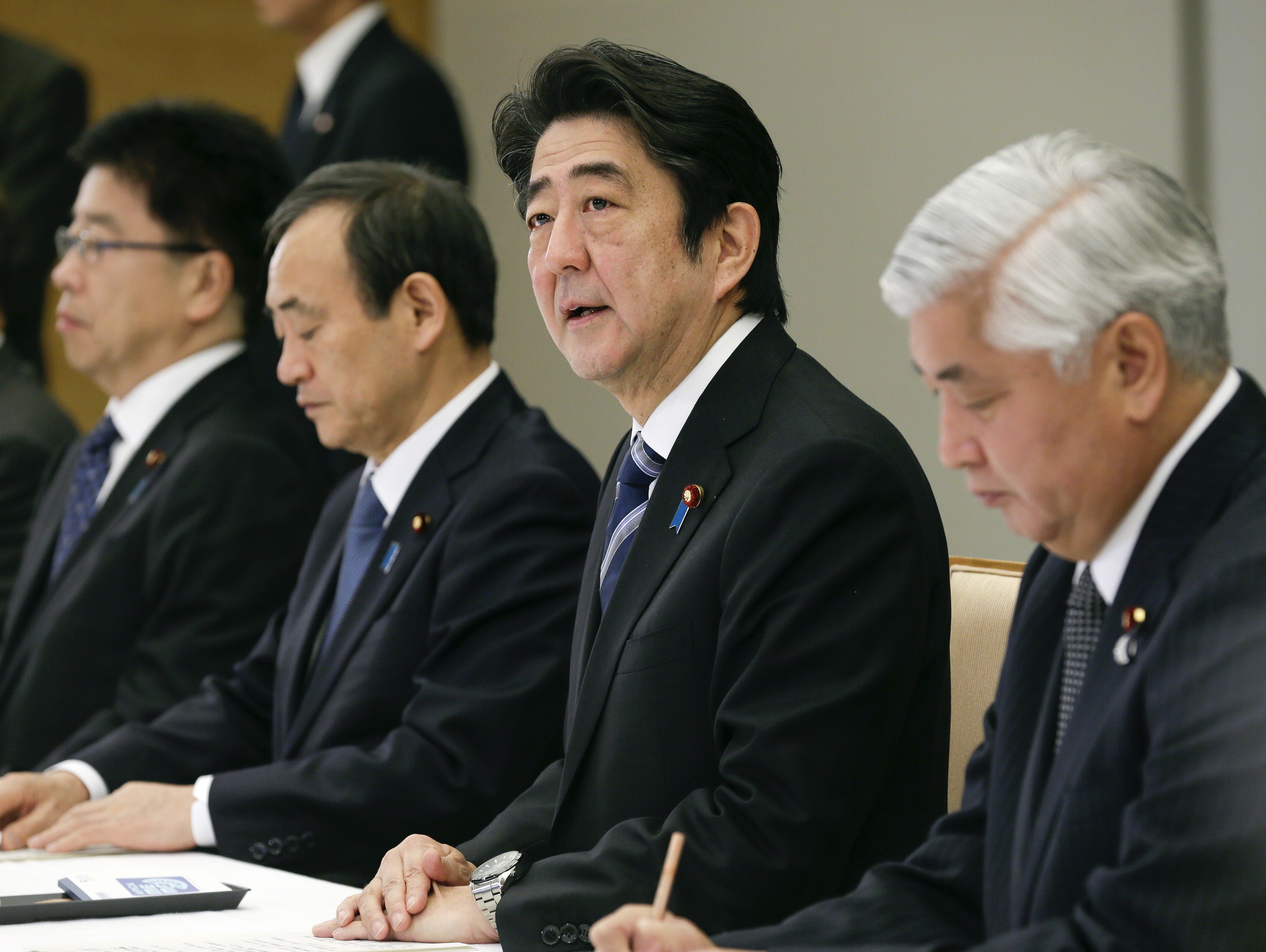 Japanese Prime Minister Shinzo Abe talks during a ministerial meeting on an online video purportedly showing a Japanese hostage being killed by the Islamic State at the prime minister's official residence in Tokyo on Feb. 1, 2015. (Kimimasa Mayama—AFP/Getty Images)
