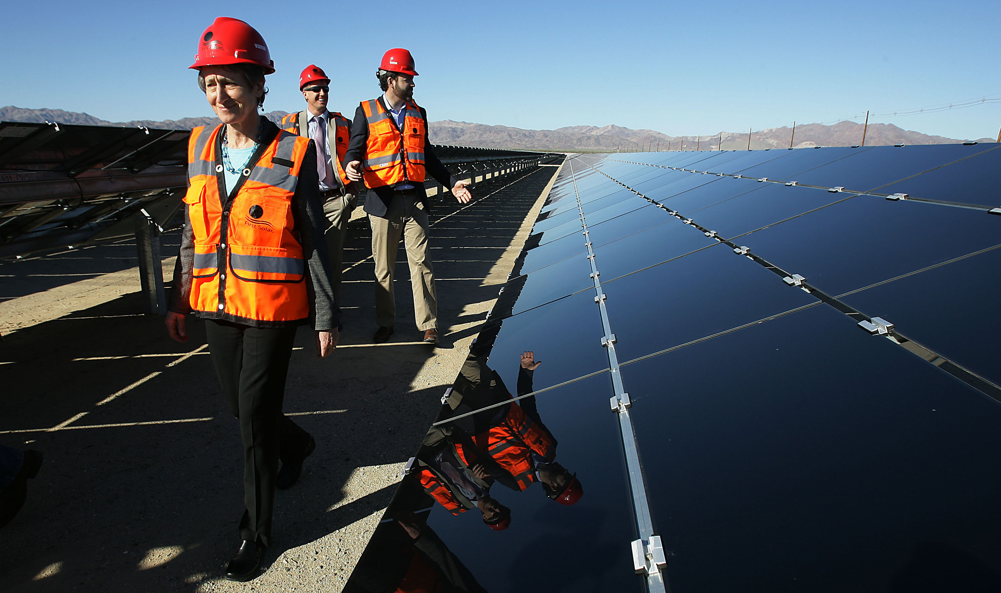 U.S. Secretary of Interior Sally Jewell, left, tours the more than six square miles of the plant during the power-on ceremony at Desert Sunlight Solar Farm in Desert Center, Calif., Feb. 9, 2015.