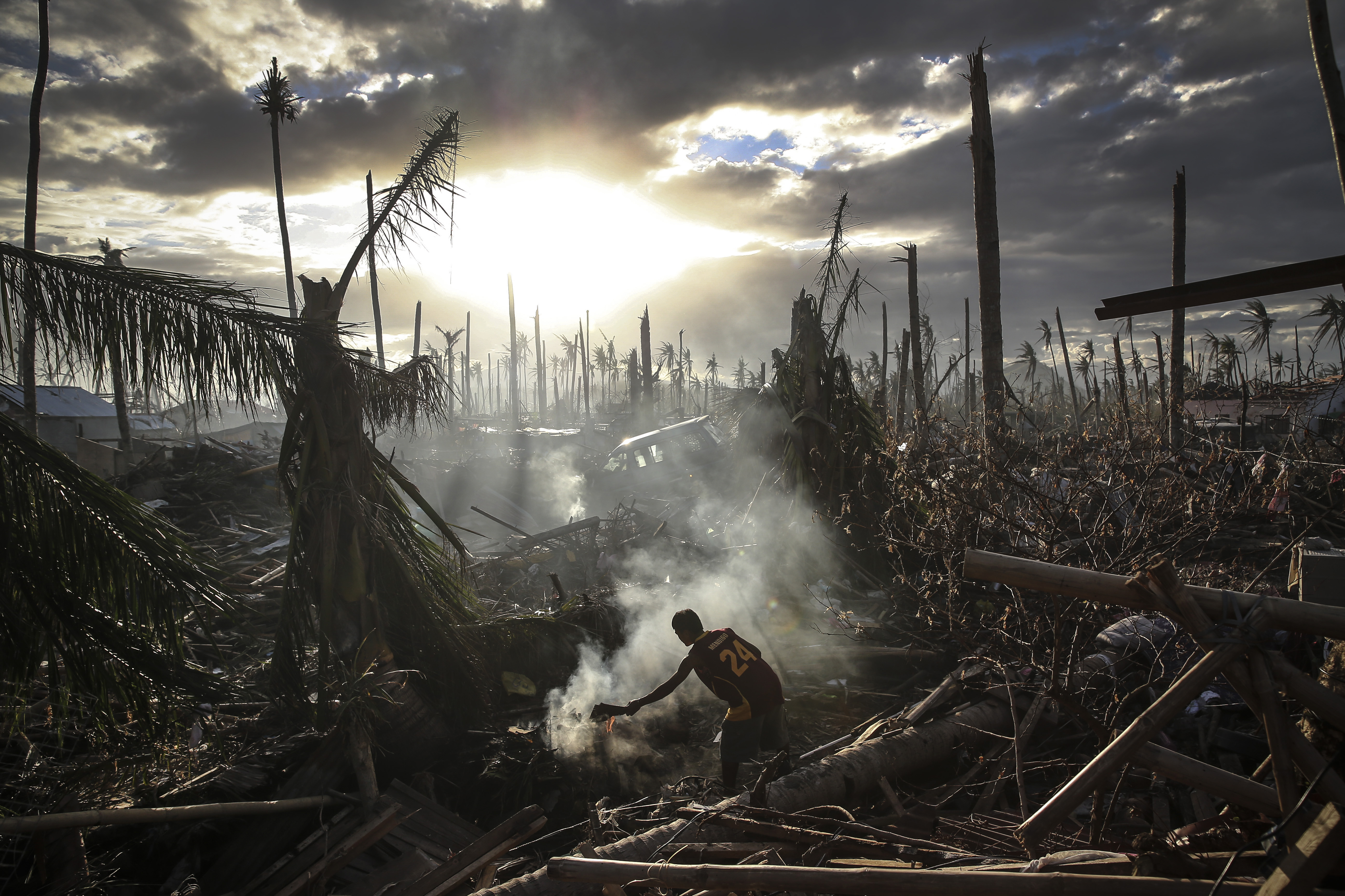 Nominated in the Current Affairs category. Dan Kitwood's work from the Philippines during Typhoon Haiyan. Pictured: A man fans flames on a fire in Tanauan, Philippines on Nov. 19, 2013.