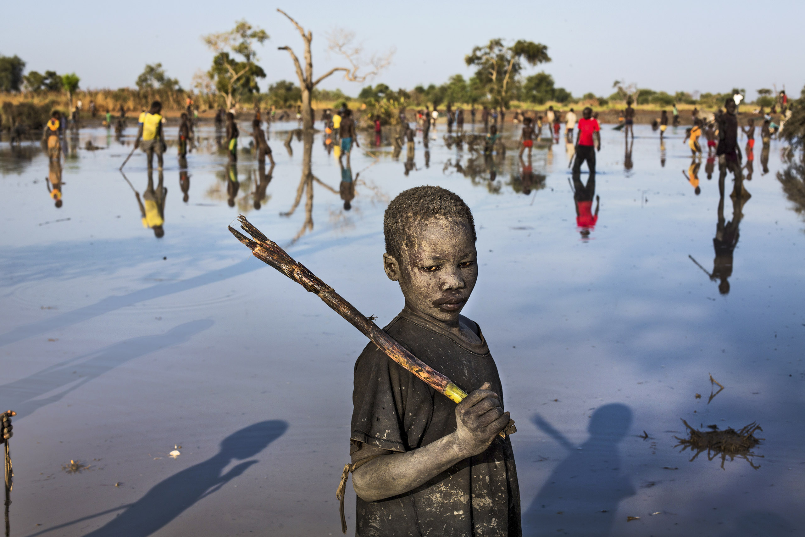 A refugee from Sudan’s Nuba Mountains fishes in South Sudan (Andrew McConnell—UNHCR)