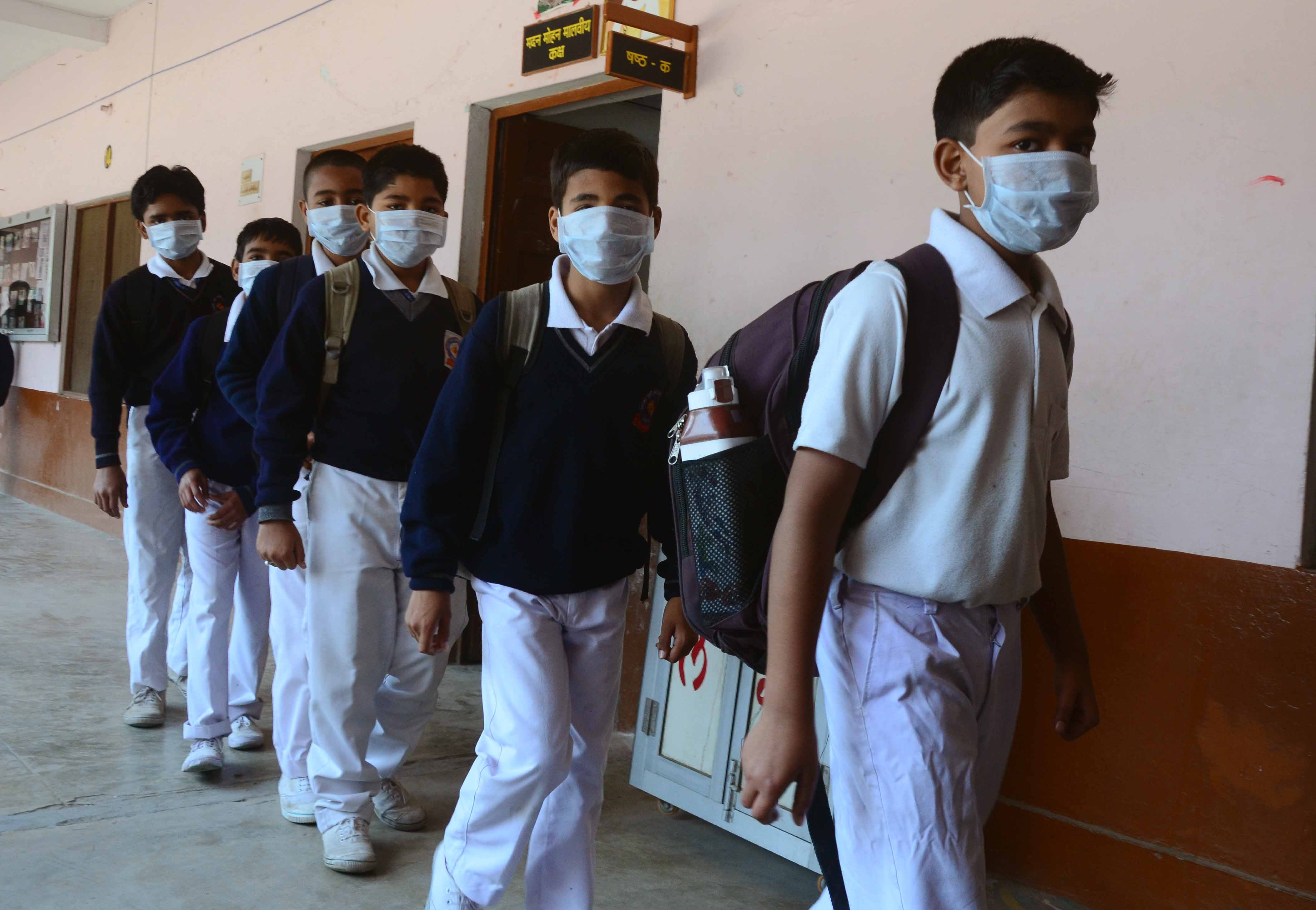 Students wearing masks to prevent getting infected by Swine