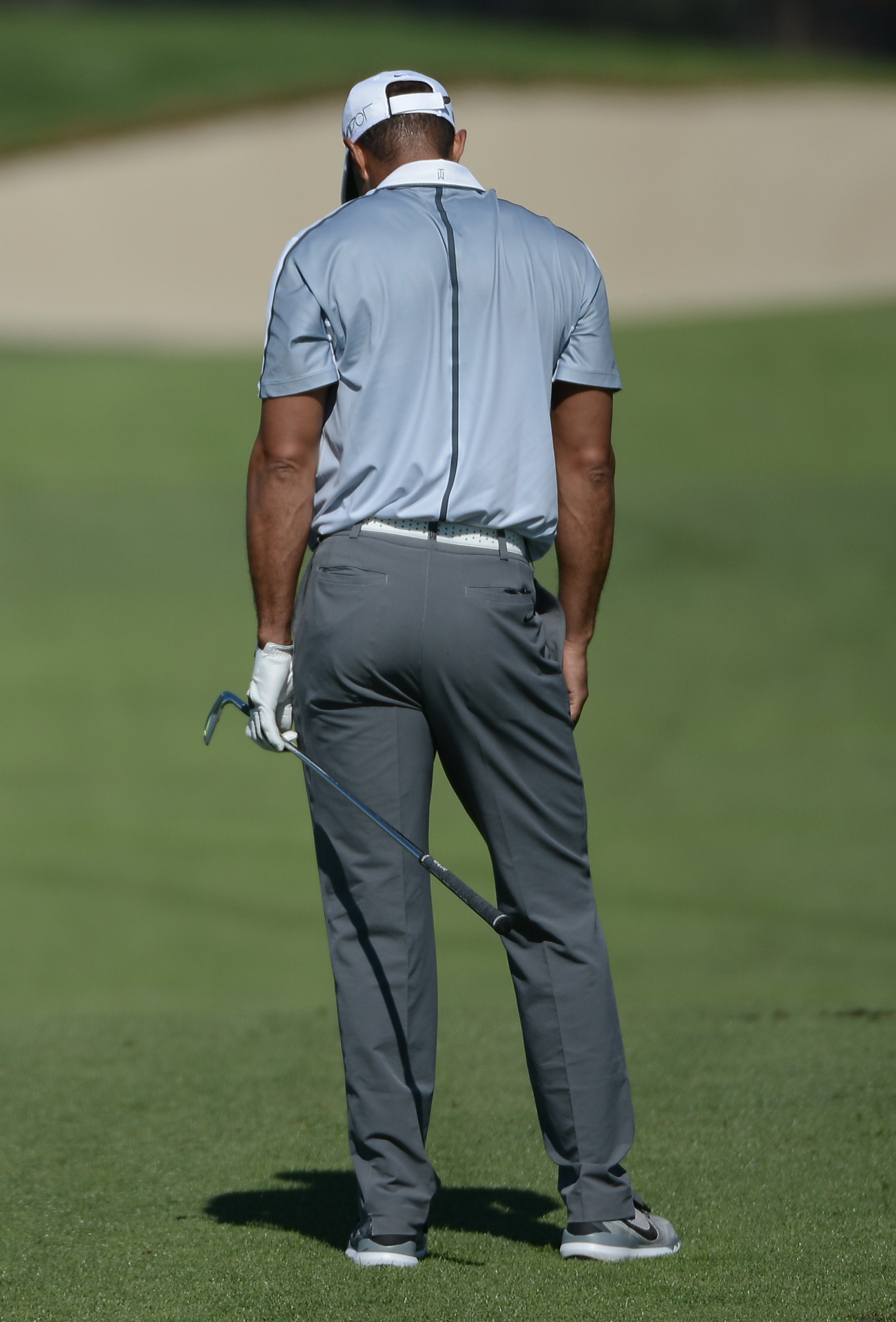Tiger Woods reacts after playing his shot from the 13th fairway on the north course during the first round of the Farmers Insurance Open at Torrey Pines Golf Course on Feb. 5, 2015 in La Jolla, California.