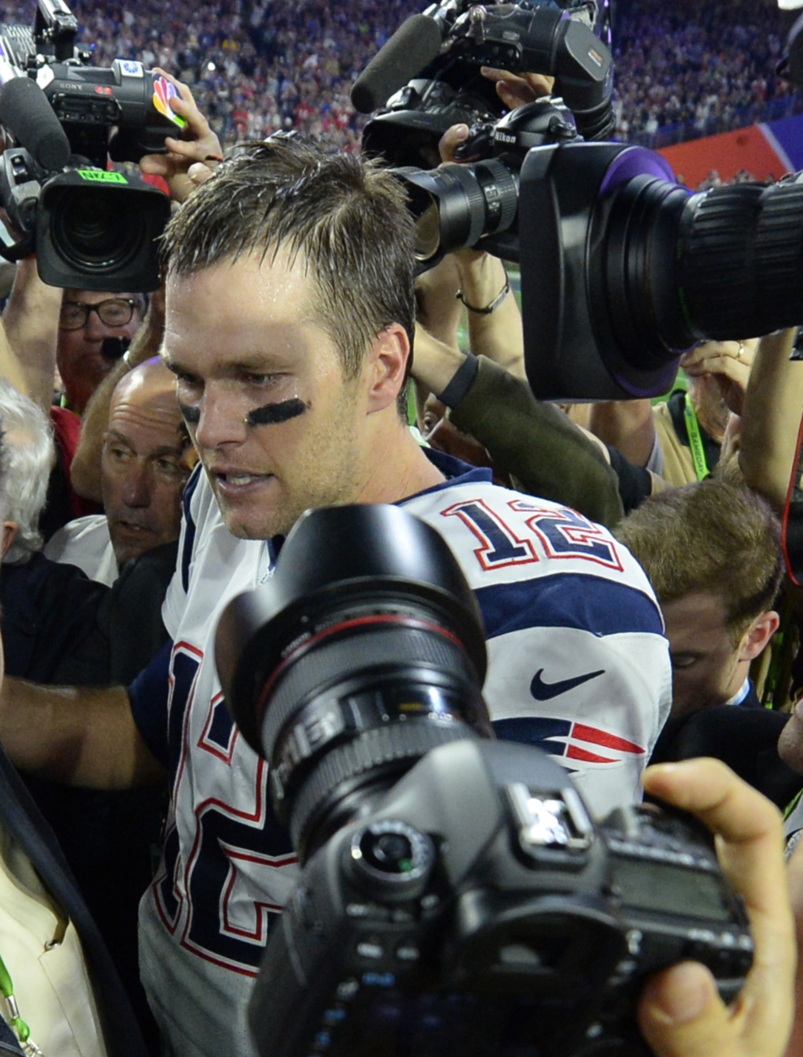 Quarterback Tom Brady of New England Patriots is surrounded by cameras following victory over the Seattle Seahawks in Super Bowl XLIX  on Feb. 1, 2015 in Glendale, Arizona. (TIMOTHY A. CLARY—Getty Images)