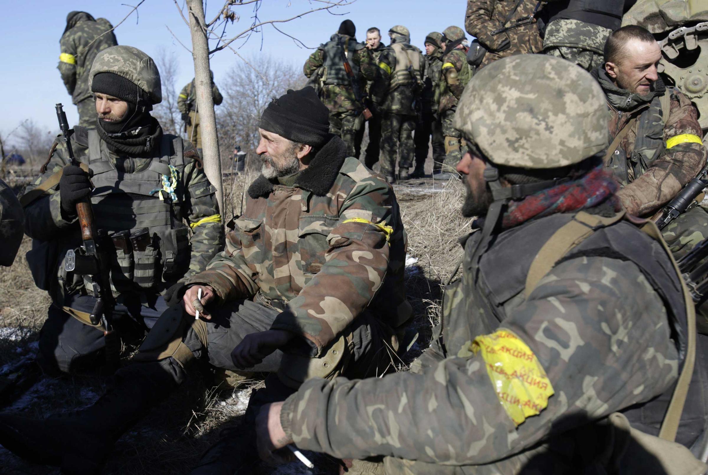 Ukrainian soldiers rest near Artemivsk after leaving Debaltseve in the Donetsk region on Feb. 18, 2015.