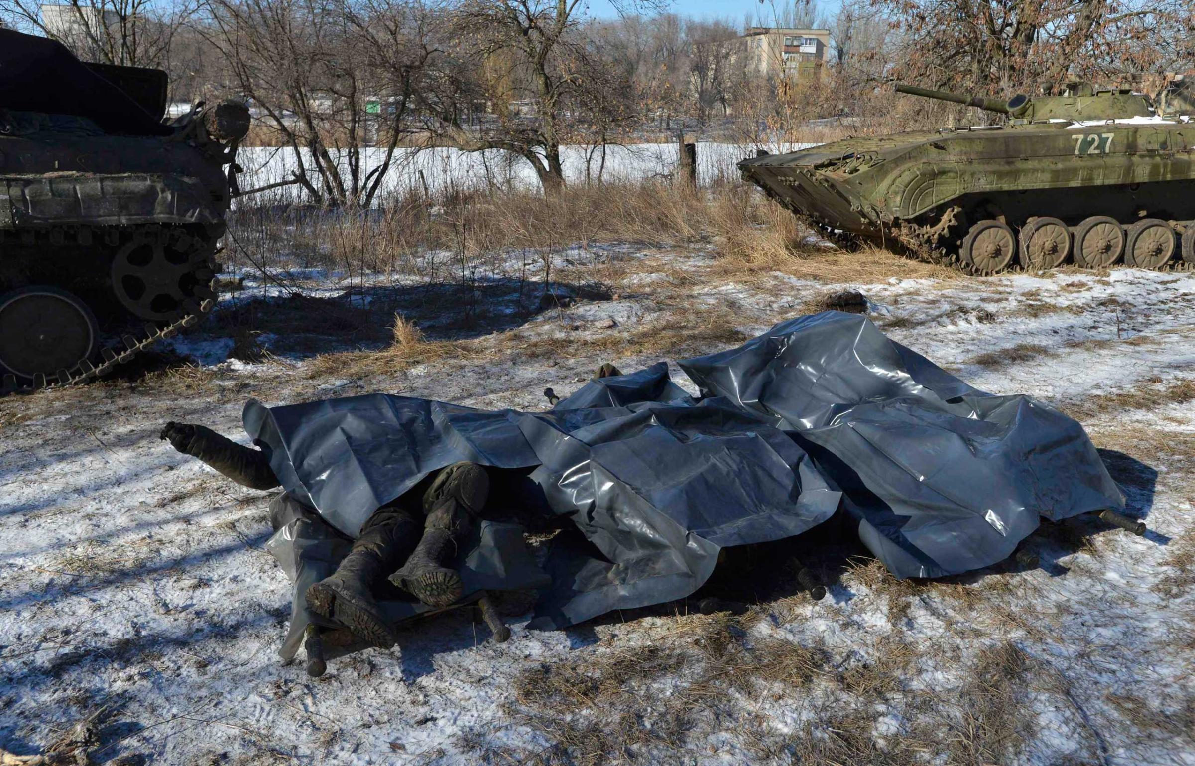 Bodies of Ukrainian soldiers killed in Debaltseve are pictured on stretchers at a military camp in Artemivsk, Feb. 18, 2015.