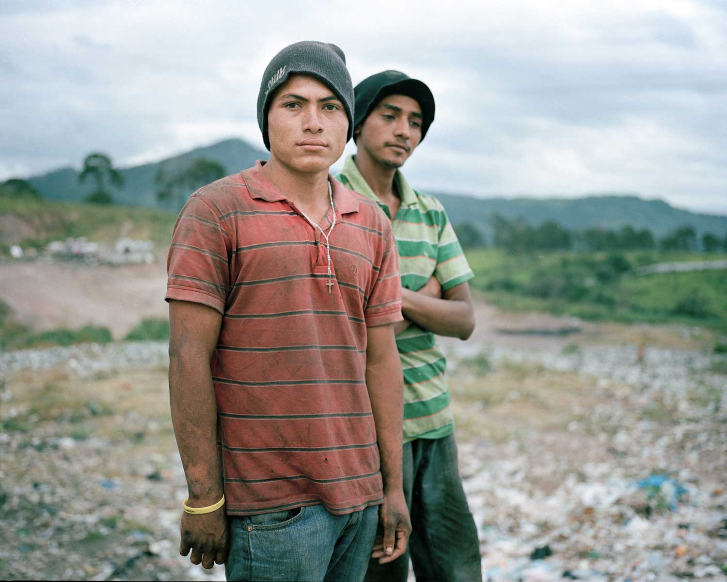 Angel and Gerson pose for a portrait in the municipal dump where they work in Tegucigalpa. This image forms part of Dominic Bracco II's Visionary Award project. (Dominic Bracco II)