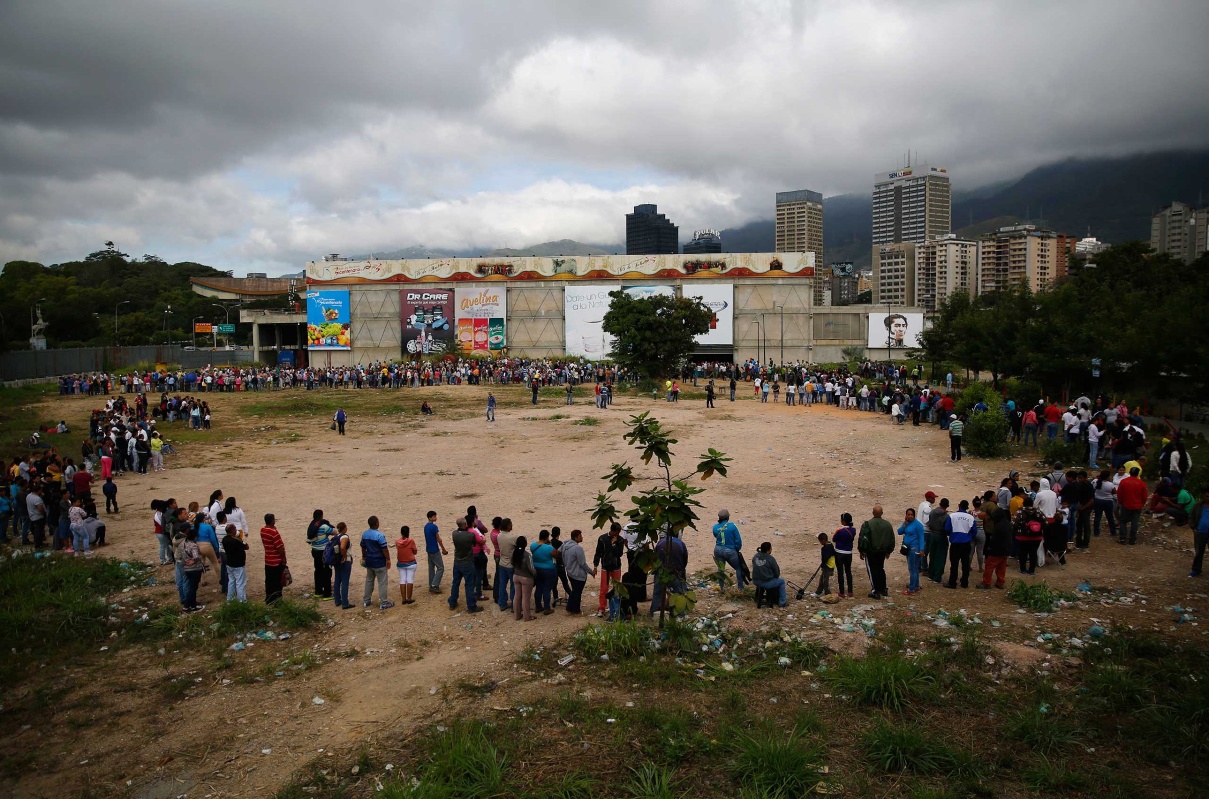 People line up outside a state-run Bicentenario supermarket in Caracas, Jan. 9, 2015.