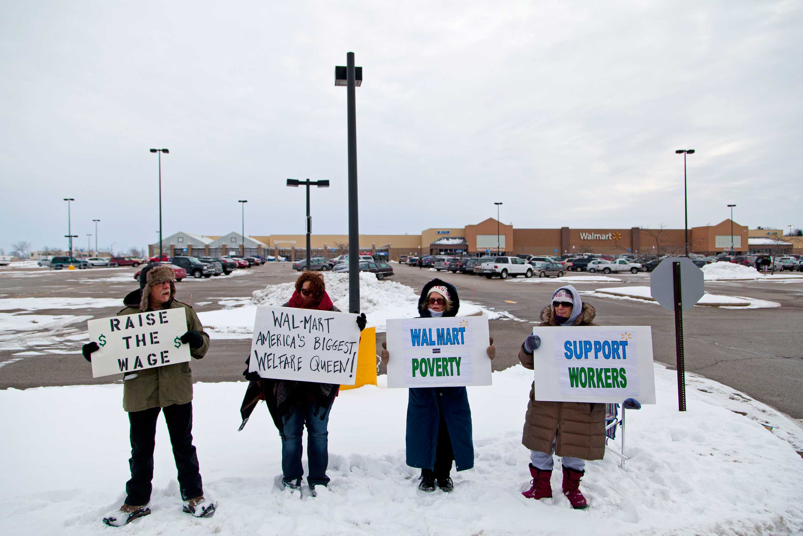 Protestors outside of the Watertown Walmart  on Black Friday, Nov. 28, 2014 in Watertown, Wis. (Darren Hauck—Getty Images)