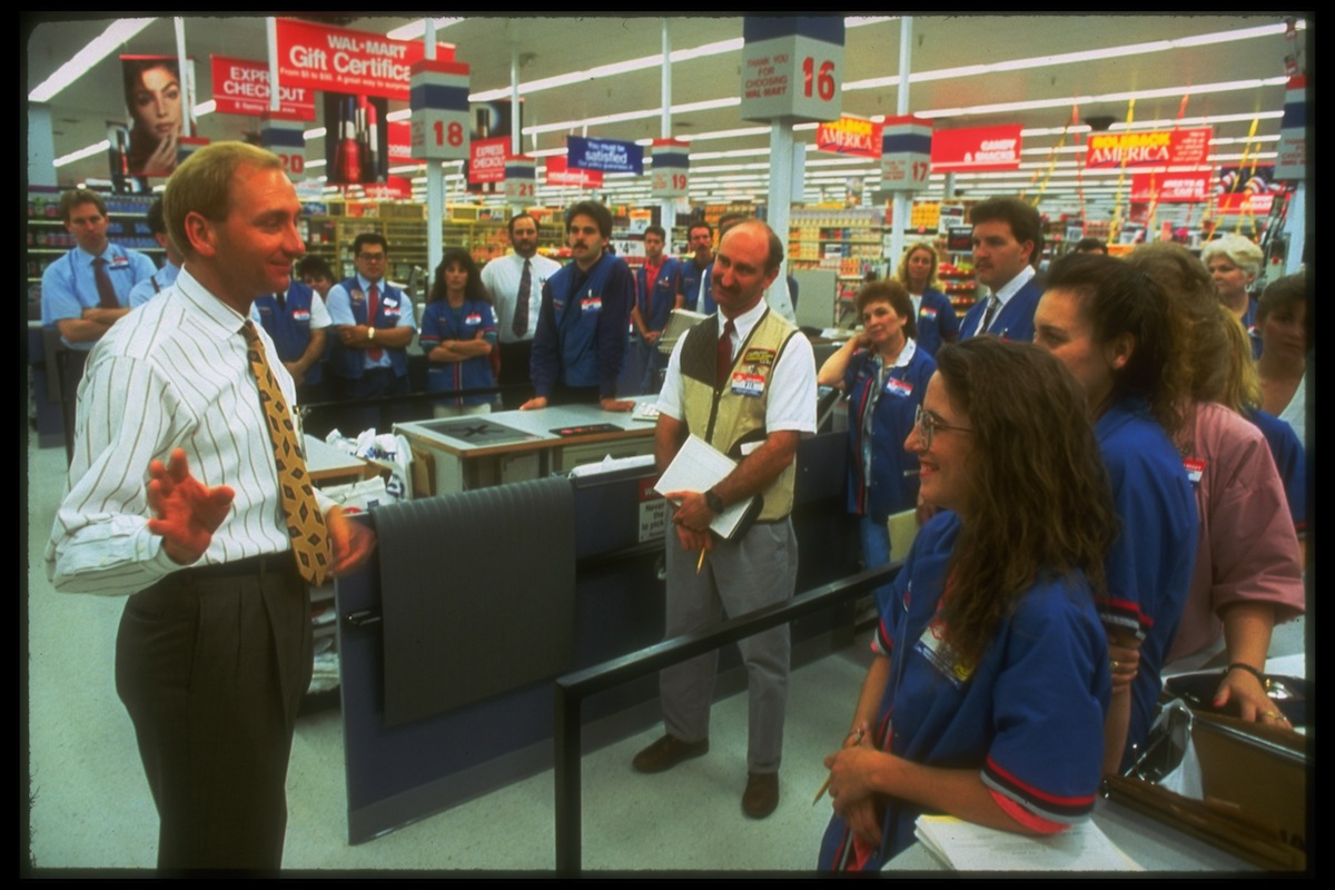 Wal-Mart regional VP Andy Wilson (L) giving a pep talk on corporate values at a Wal-Mart store, in 1992 (Alan Levenson—;The LIFE Images Collection/Getty)