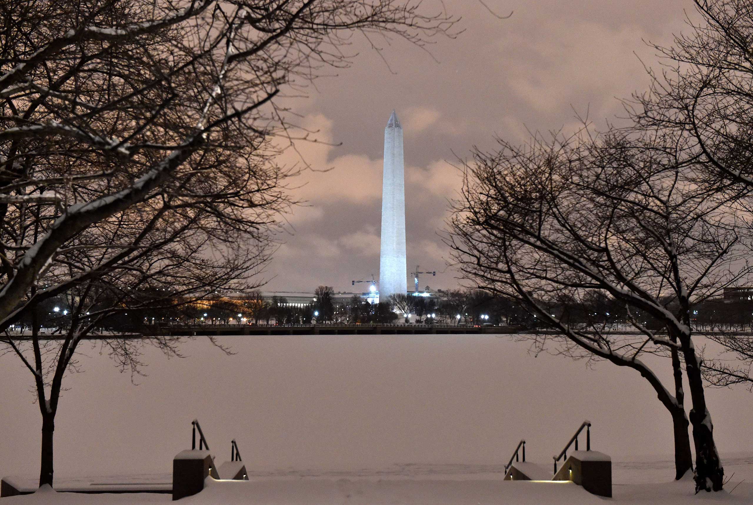 Snow covers the Tidal Basin in front of the Washington Memorial in Washington on Feb. 16, 2015.