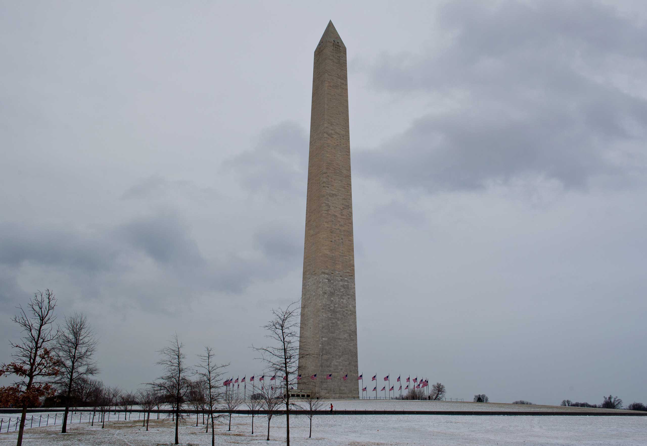 A jogger passes the Washington Monument on a cold blustery morning January 27, 2015 in Washington, DC. (Karen Bleier—AFP/Getty Images)