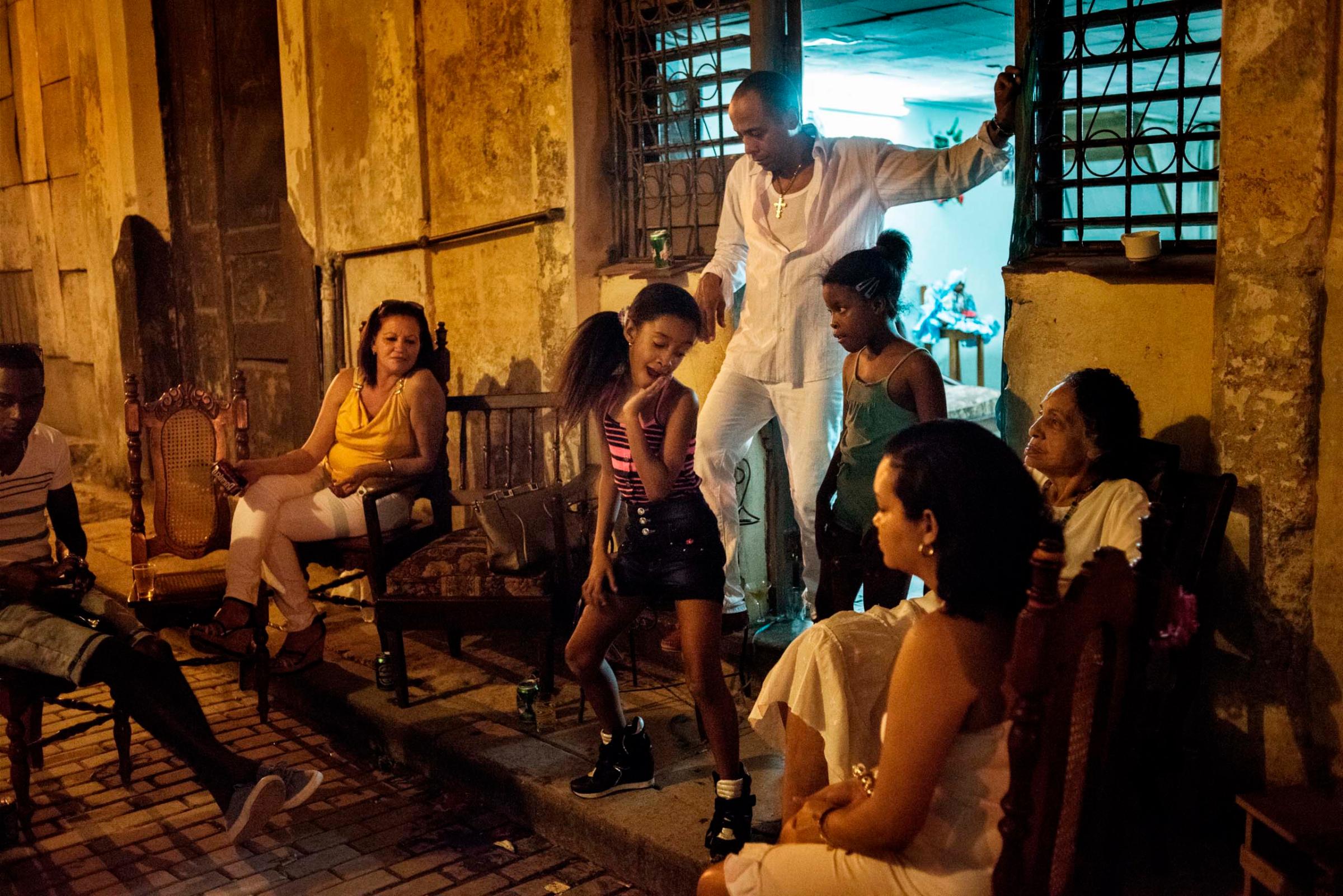 A family gathers outside of their home in Havana, Cuba, Jan. 2015.Yuri Kozyrev—NOOR for TIME