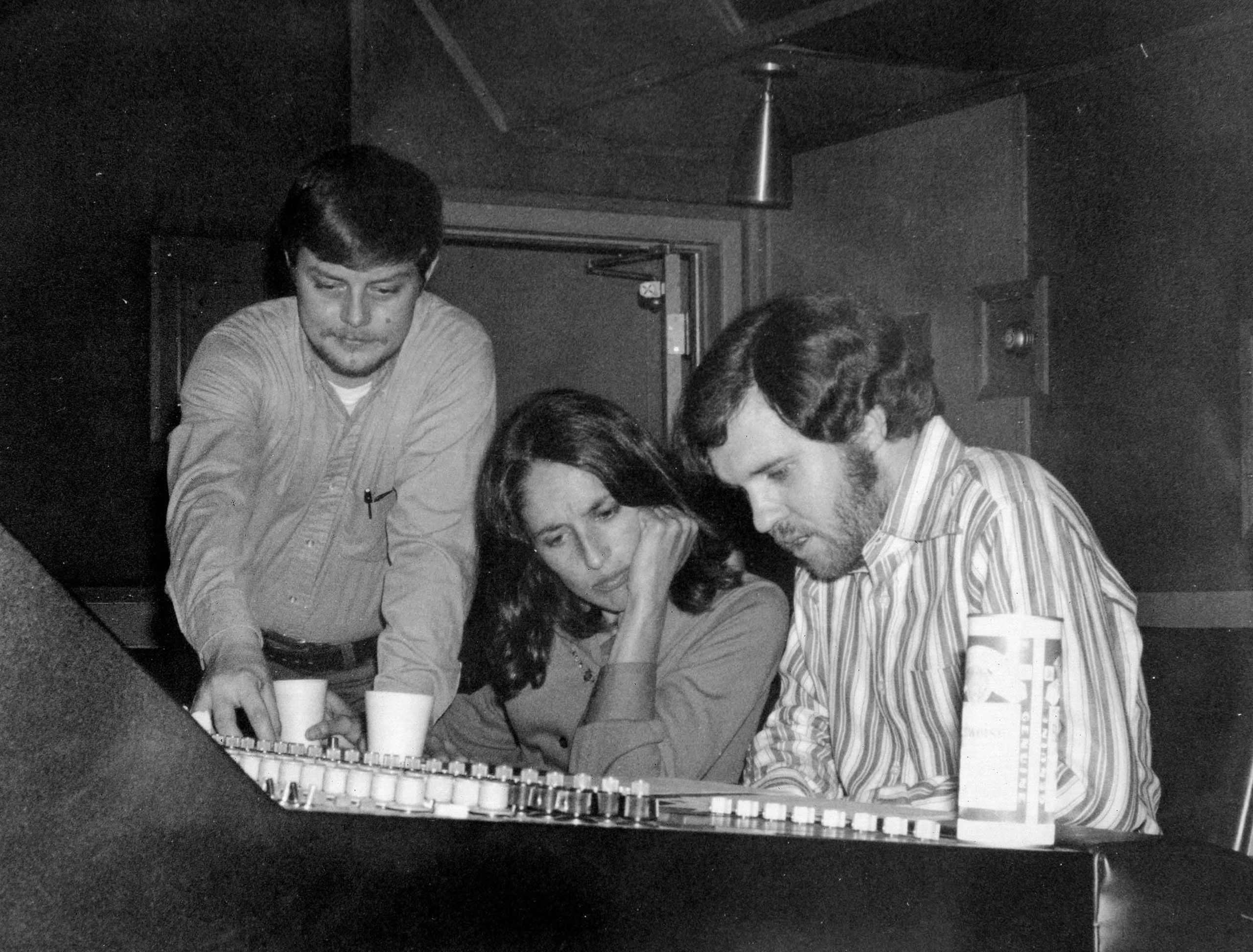 Ernie Winfrey (standing), Joan Baez, and Norbert Putnam (l-r) at Woodland Studios in the 1970s