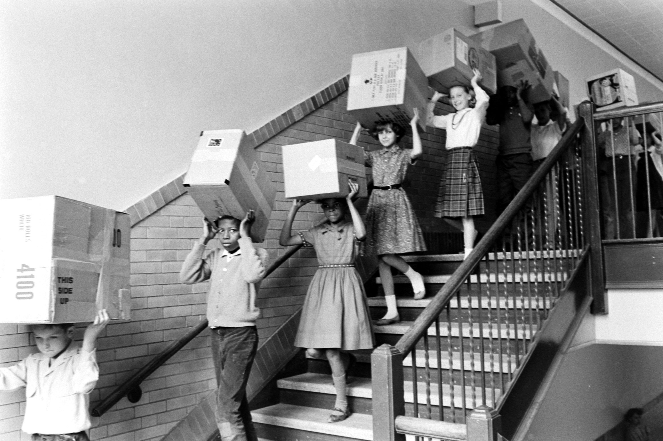 Children demonstrate how to watch a solar eclipse in 1963