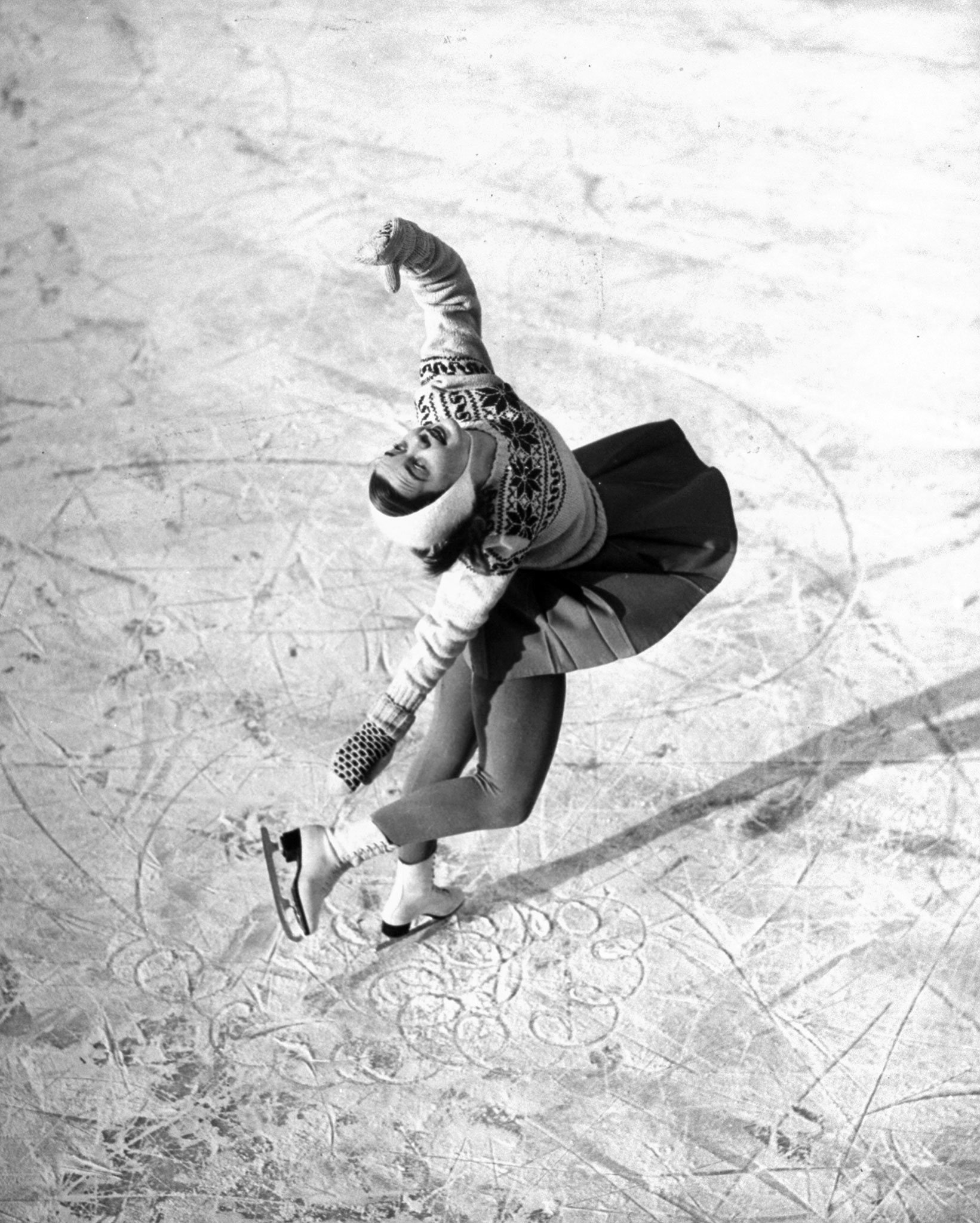 Ice skater Barbara Ann Scott makes her school figures with perfect loops and whorls as she annexes the world championship in Stockholm.