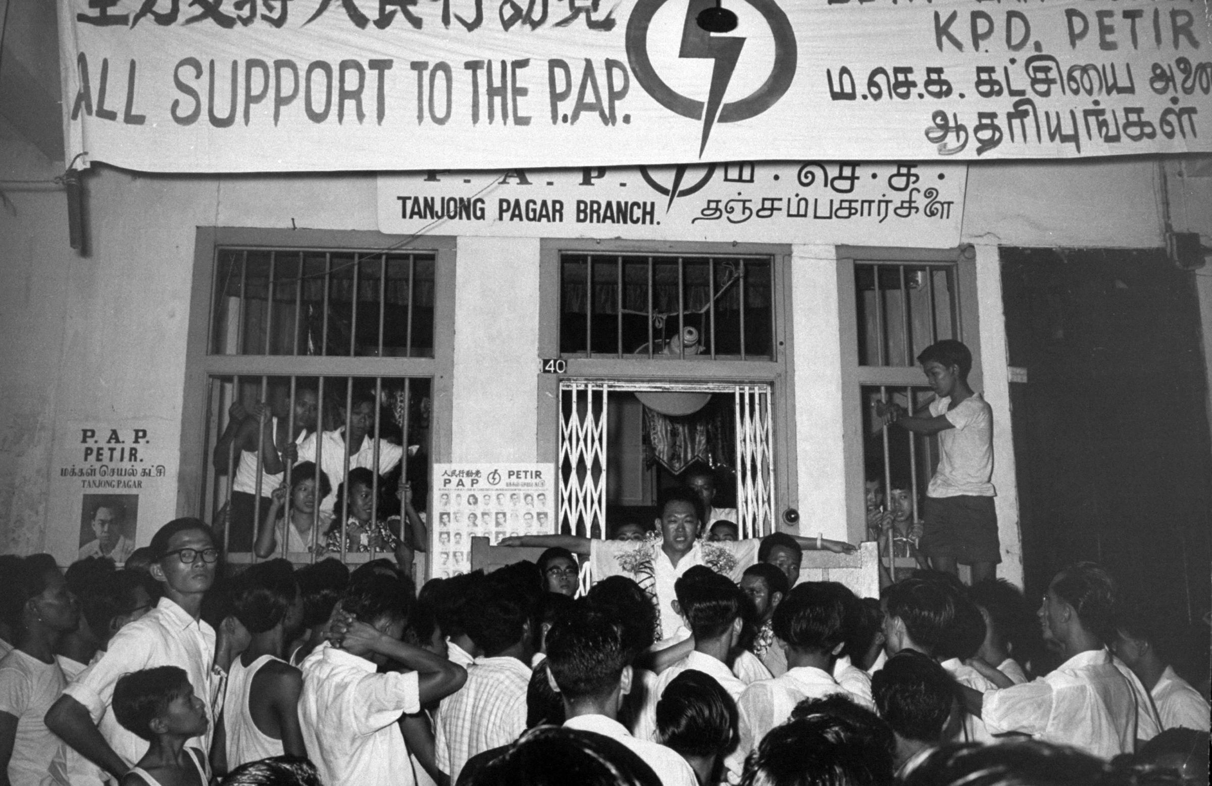 Crowd gathering around Lee Kuan Yew, Singapore, 1959.