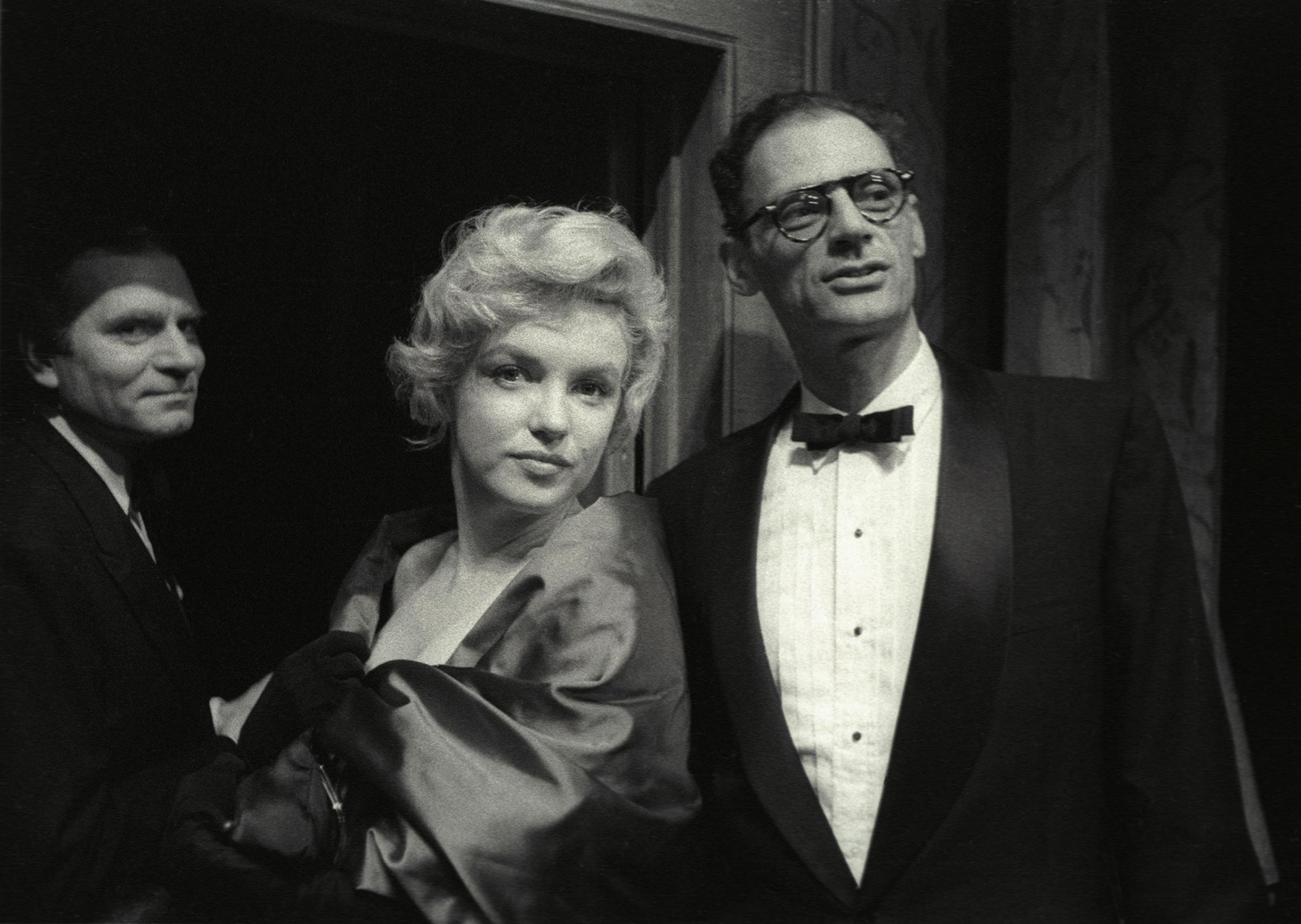 Marilyn Monroe, and her husband, Arthur Miller at a first night for Miller's play A View From the Bridge at the Comedy Theatre, October,1956.