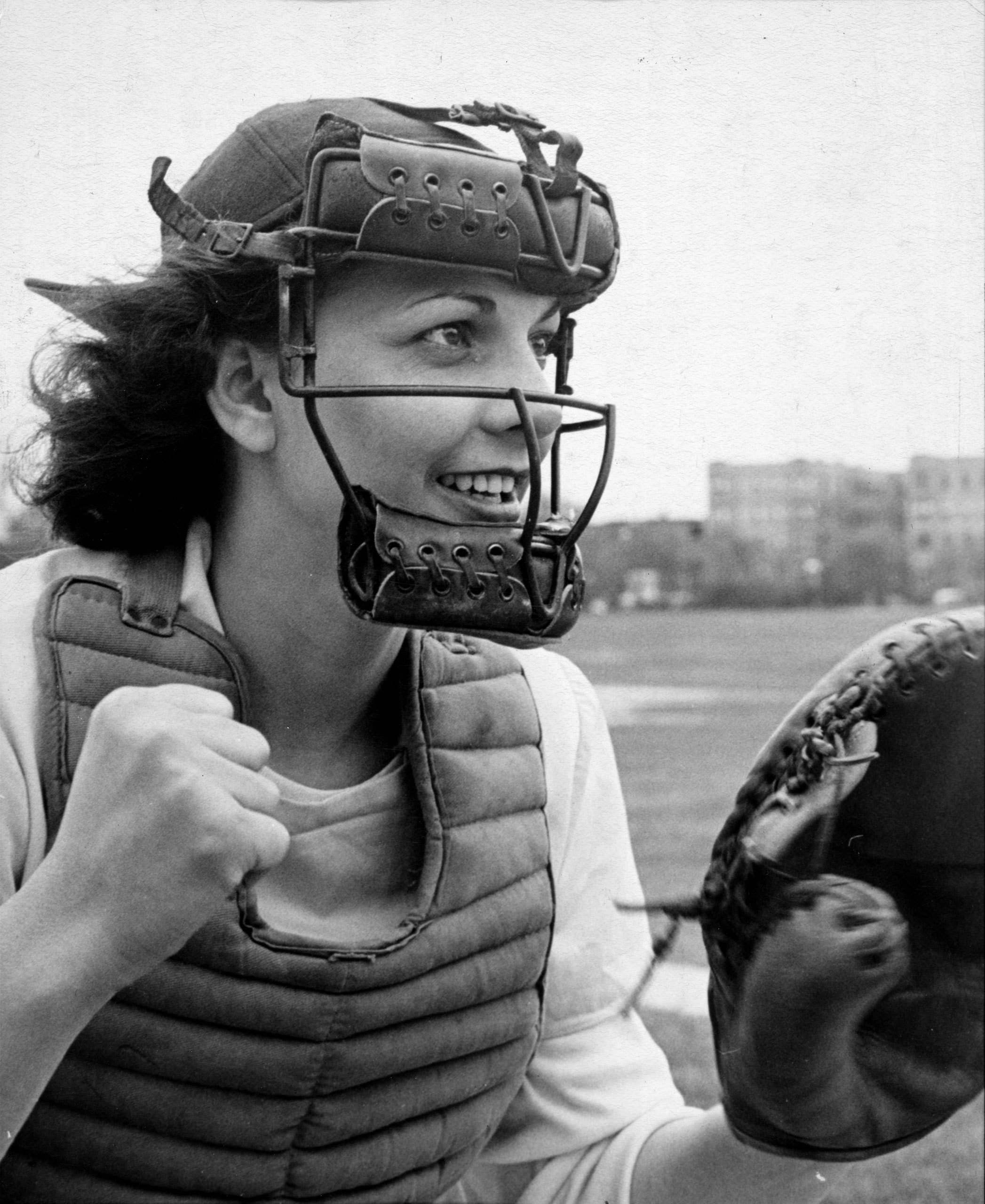 Catcher May "Bonnie" Baker of the South Bend Blue Sox has five brothers, four sisters, all of them catchers on Canadian ball teams. Bonnie once set a grade-school record by throwing a ball 345 feet. She also rides, swims and bowls.